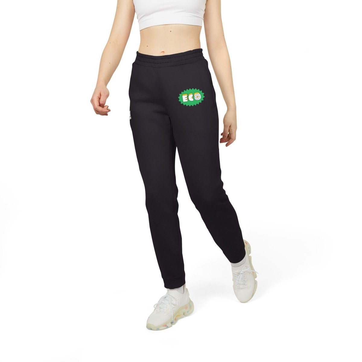Model wearing eco Adidas pants in black with vibrant green eco logo for a casual look