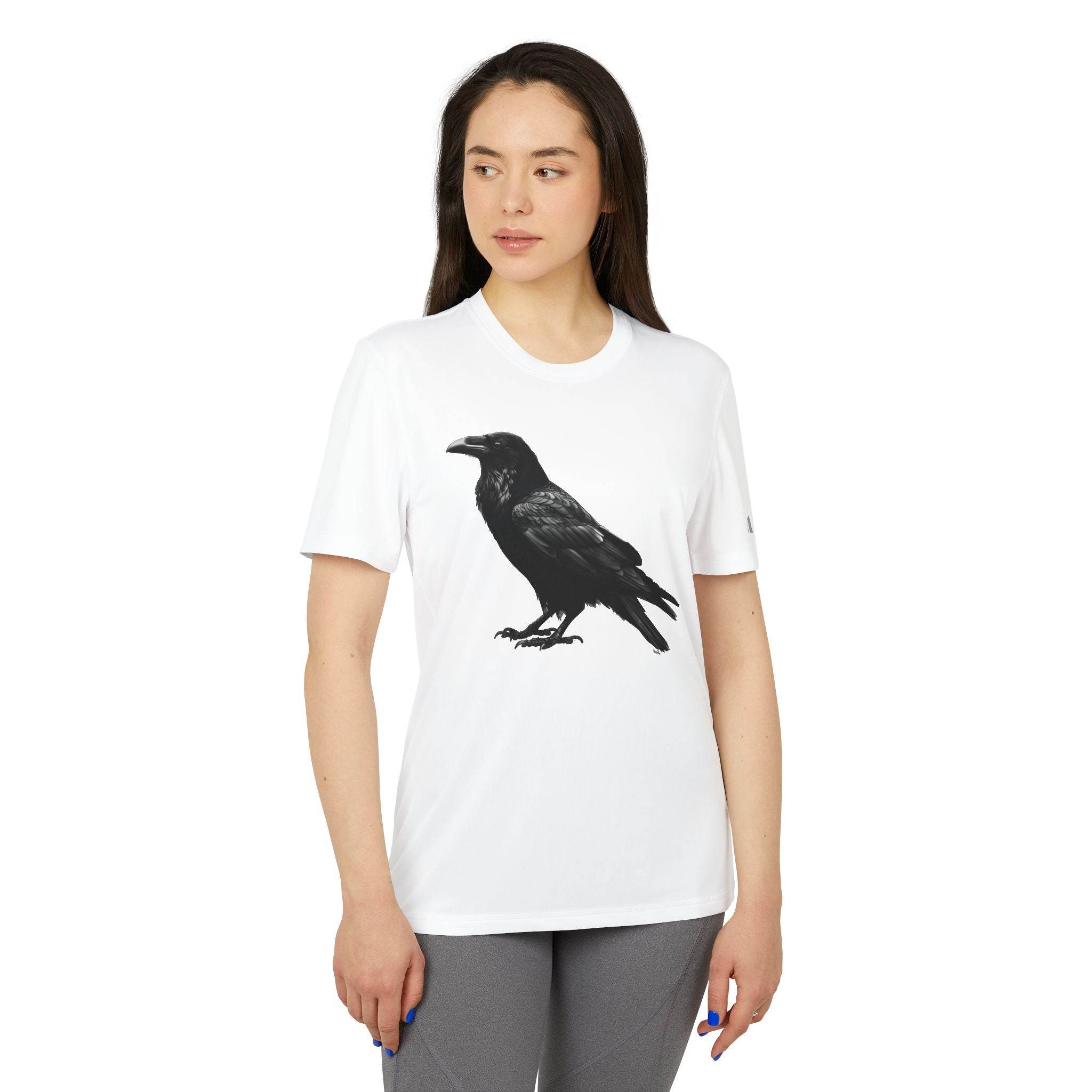 Eco-friendly Adidas sport t-shirt by Printify featuring a black raven graphic on white fabric