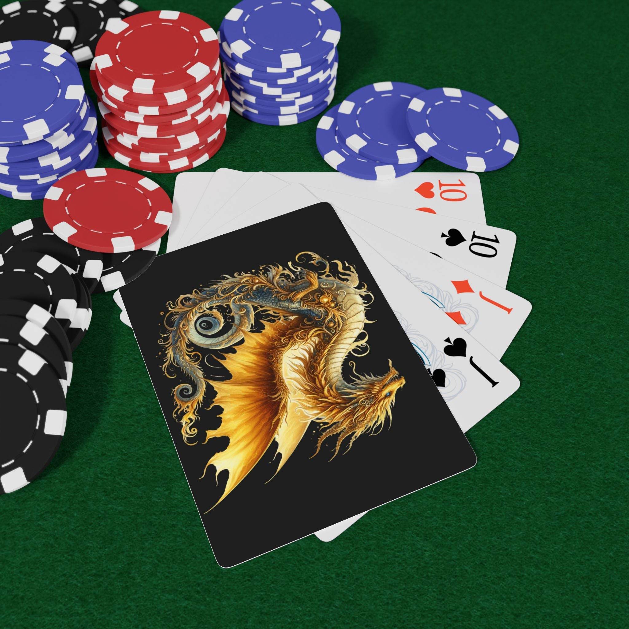 Dragon design playing cards with detailed golden dragon illustration and poker chips on green felt