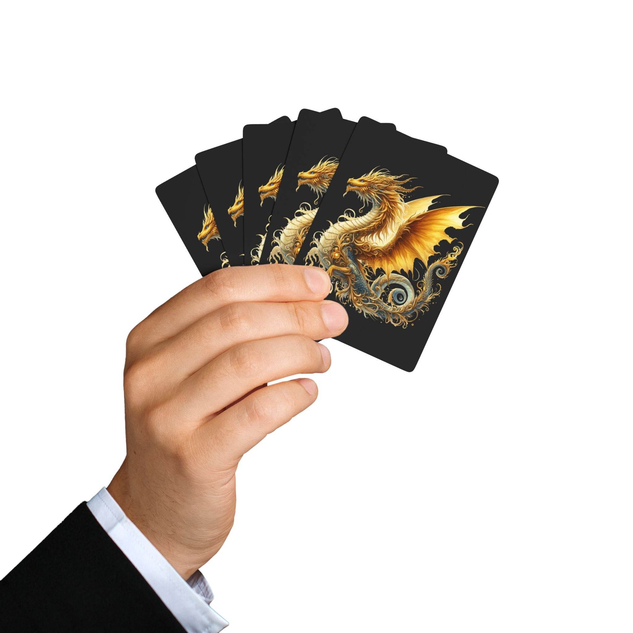 Hand holding fan of dragon design playing cards with golden dragon artwork on black background