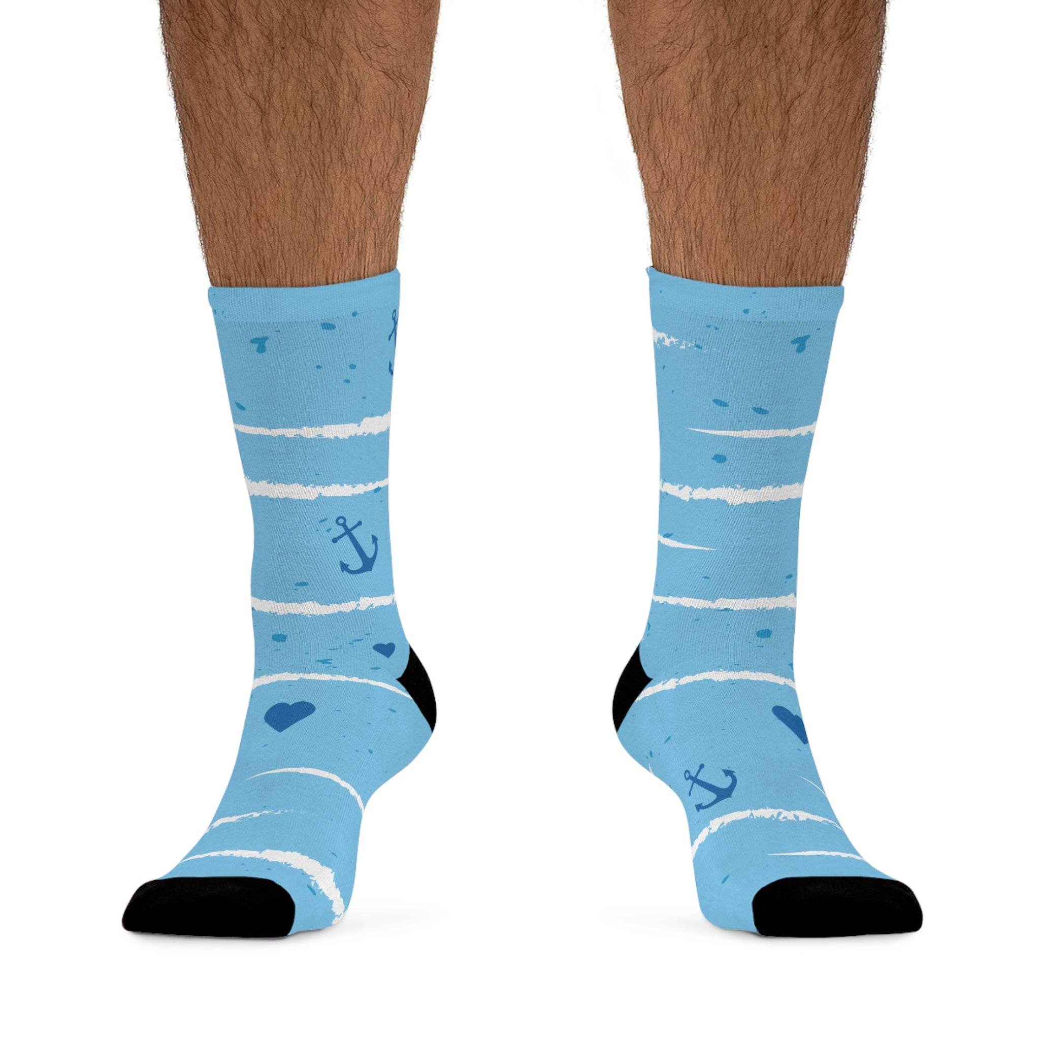 Light blue recycled poly socks with white stripes, navy anchors, and hearts on feet