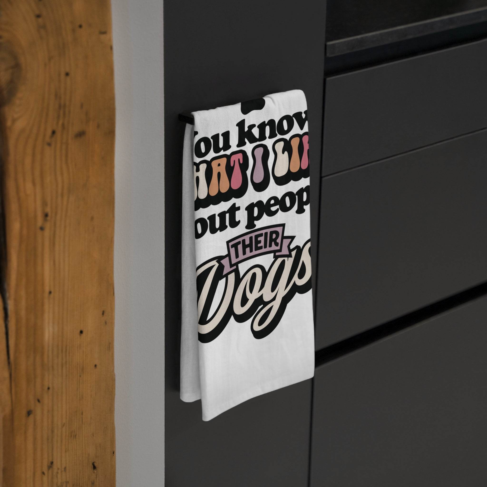 Printify sustainable kitchen towels hanging on black kitchen cabinet handle with text design