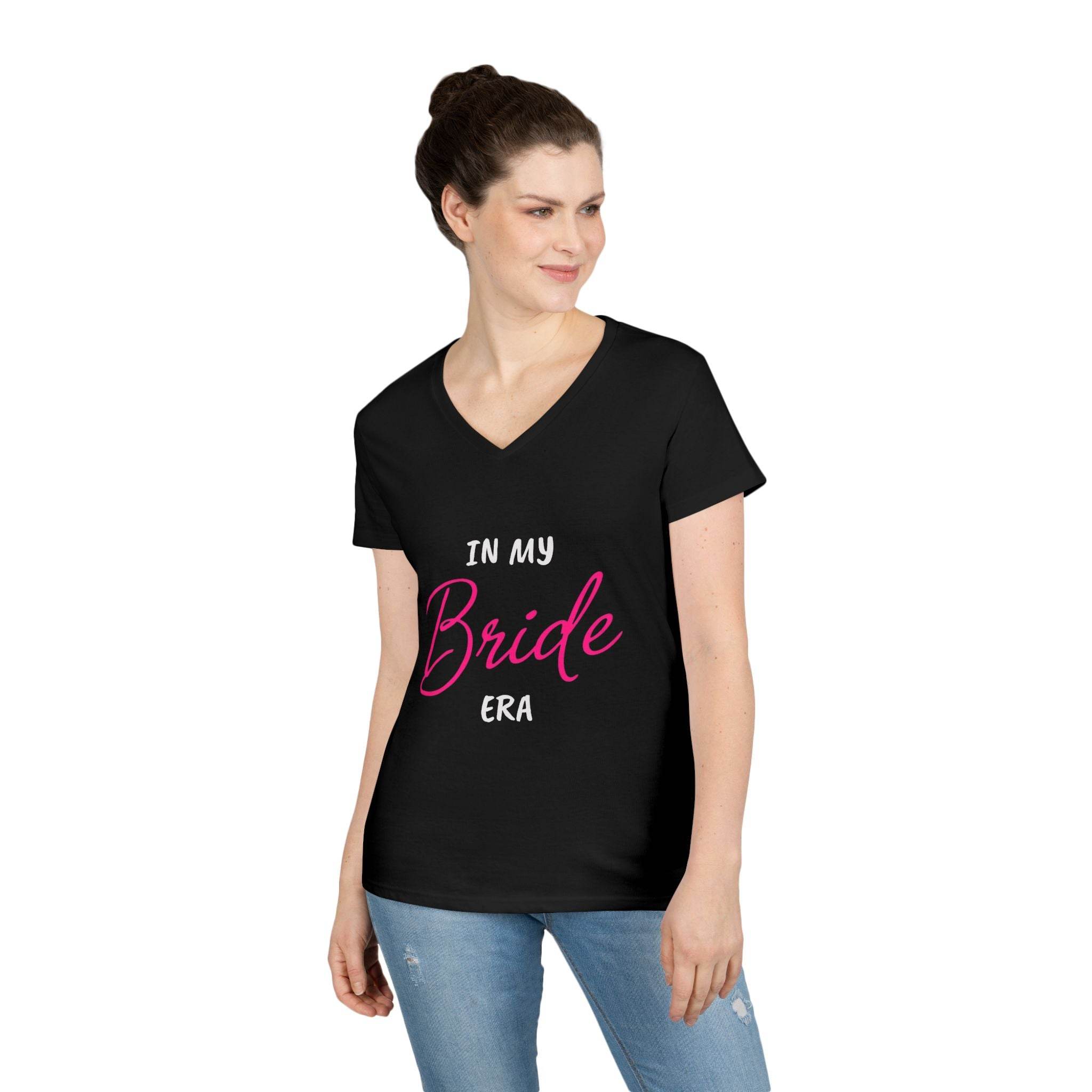 Printify eco-friendly bride t-shirt black v-neck with pink Bride script worn by smiling woman in jeans