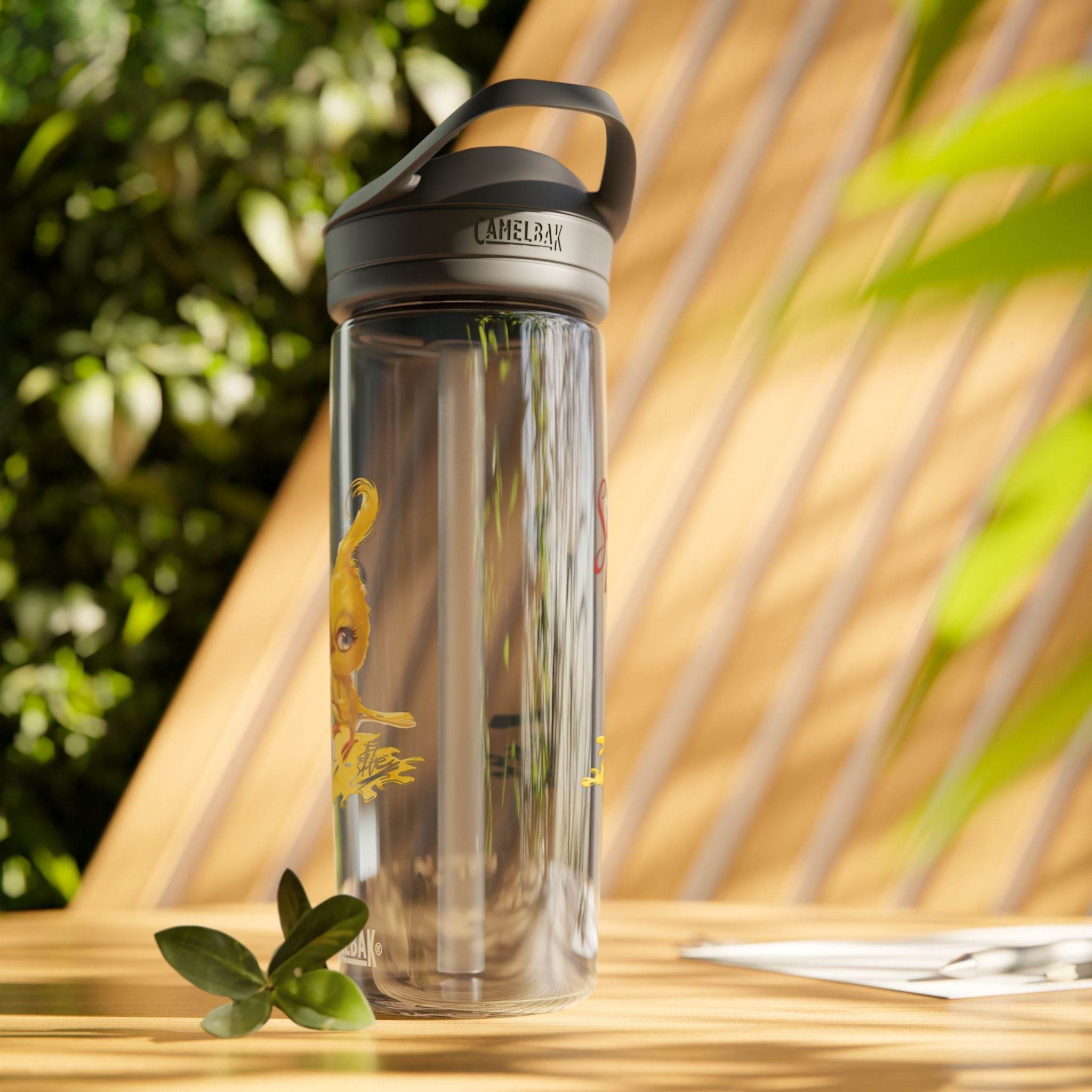 Printify eco-friendly water bottle with black lid and clear body placed on wooden table outdoors