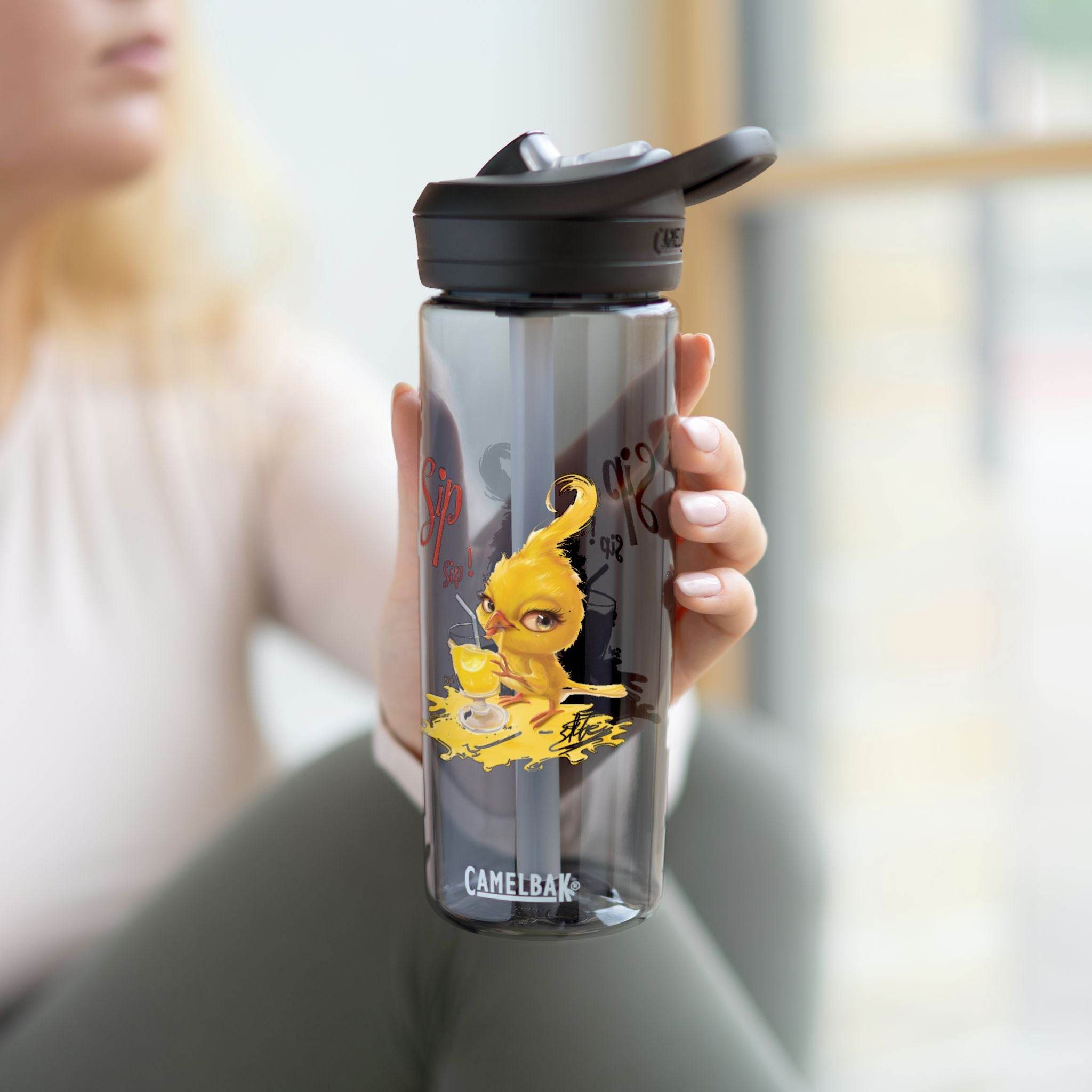 Printify eco-friendly water bottle with black lid and yellow bird design held by person