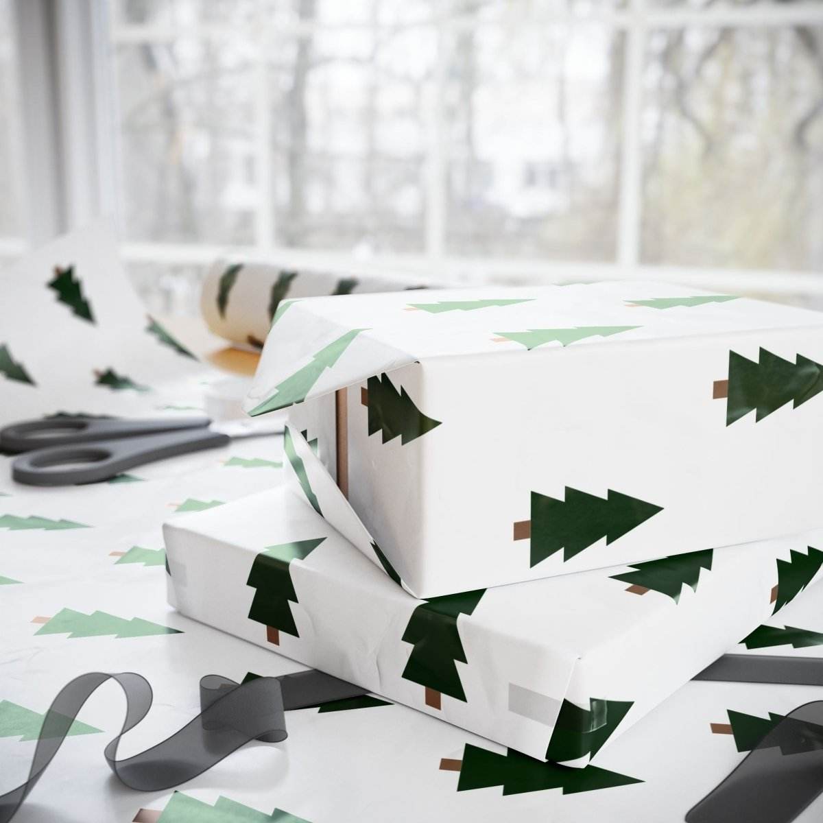 Christmas tree wrapping paper with green tree prints used to wrap gifts near scissors and ribbon