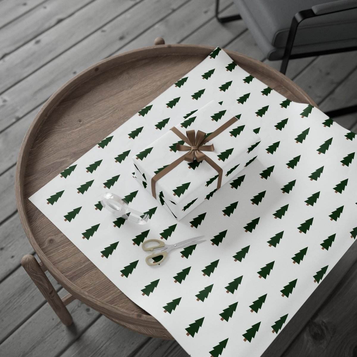 Christmas tree wrapping paper with green tree pattern on white background wrapped around holiday gift boxes on wooden table