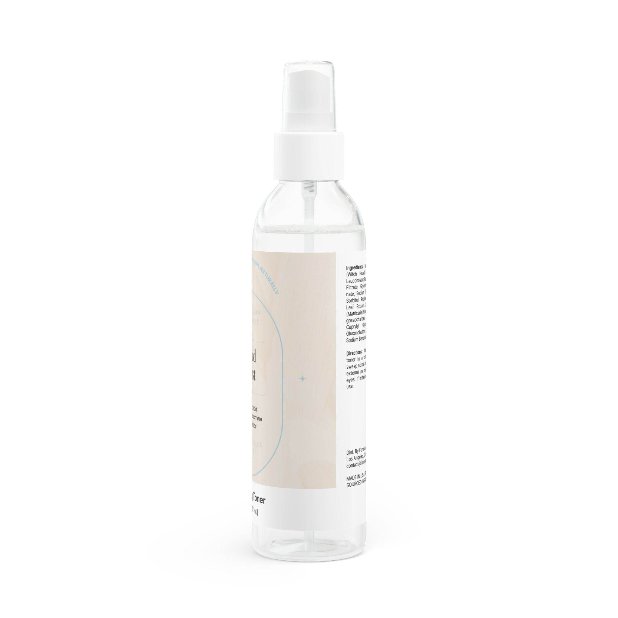 Clear spray bottle of natural face toner for hydration with white pump and minimal label design