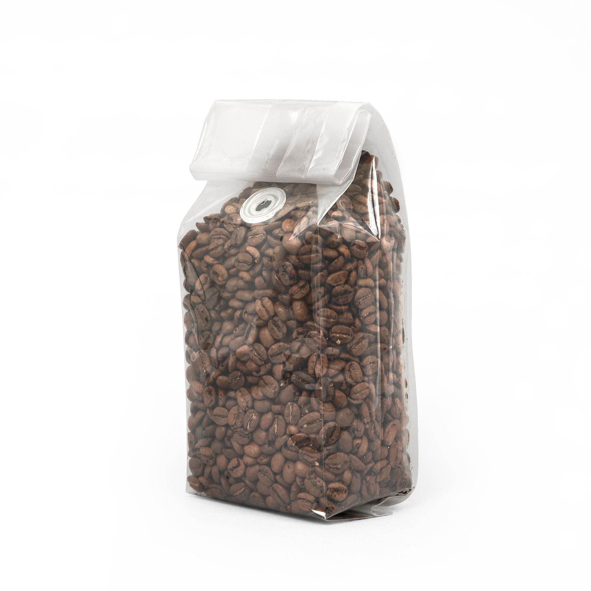 Printify medium-dark roast sustainable coffee beans packed in a clear sealed bag