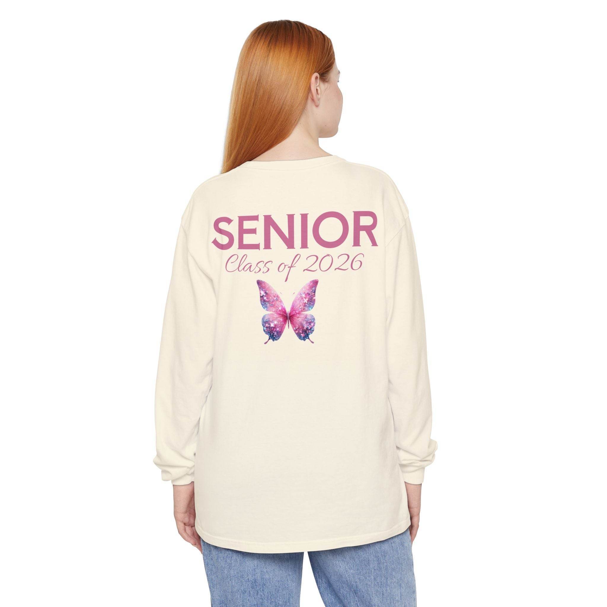 Printify cream long sleeve shirt back view with pink butterfly and SENIOR Class of 2026 text for senior class of 2026 shirt