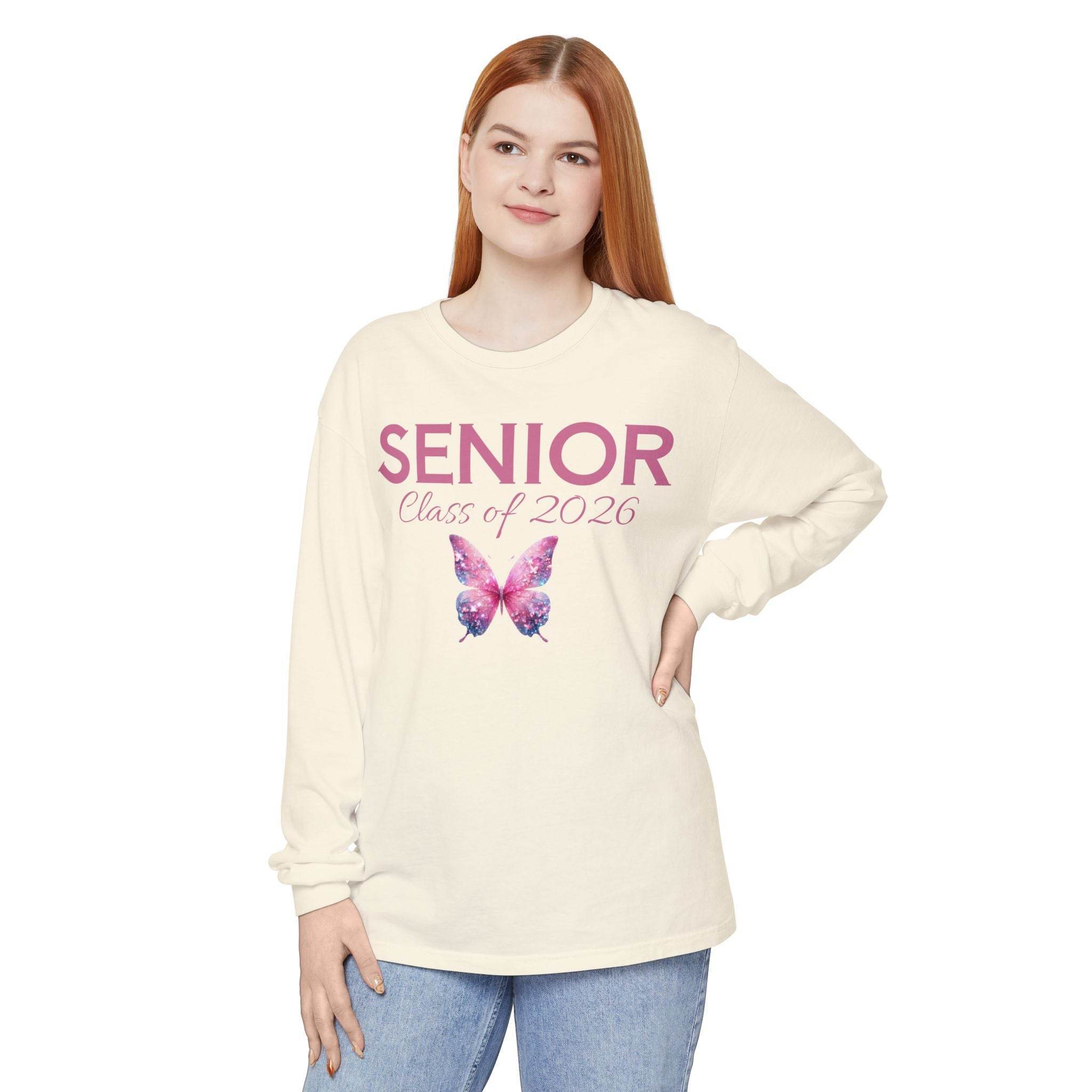 Printify long sleeve cream senior class of 2026 shirt with pink SENIOR text and galaxy butterfly graphic
