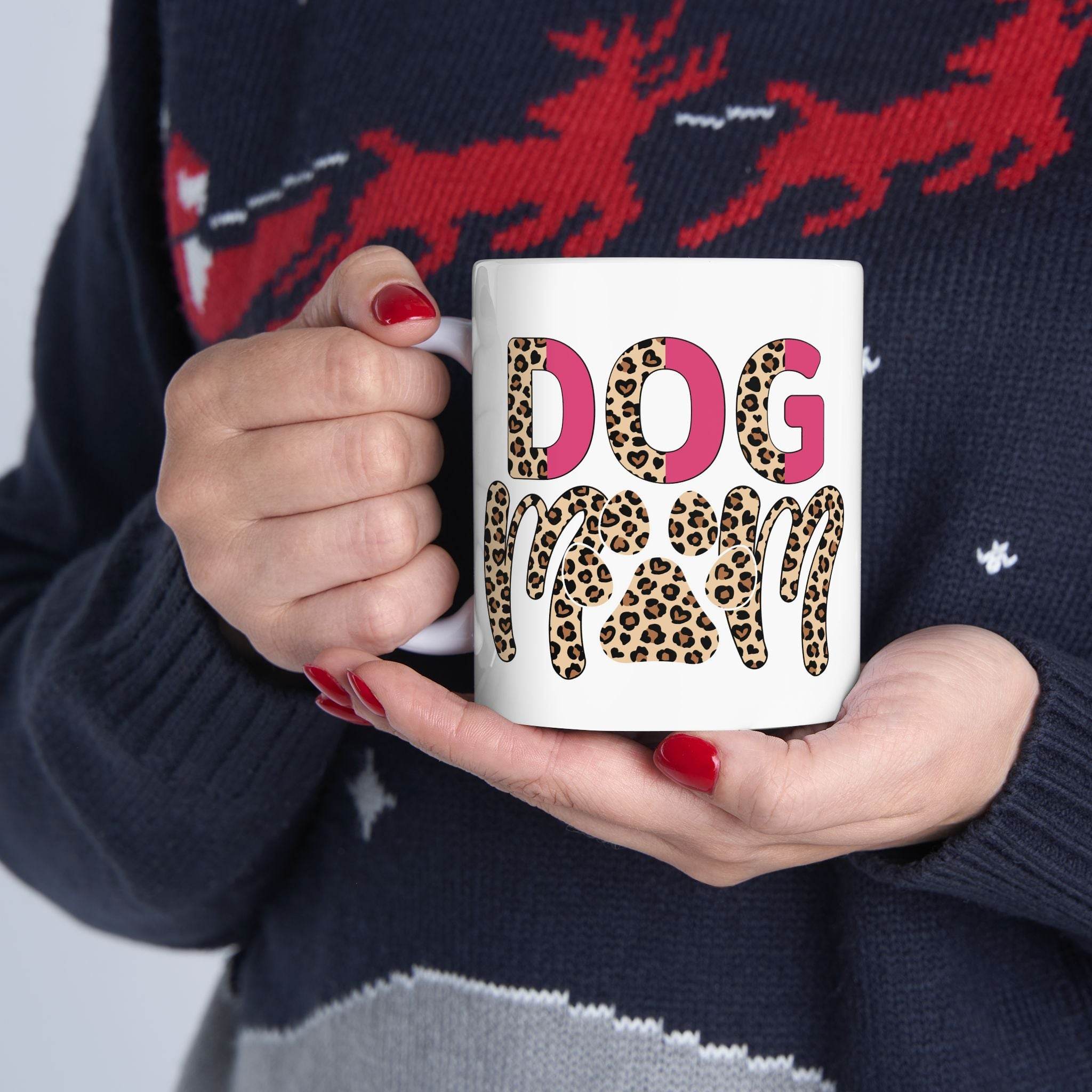 eco friendly ceramic dog mom mug white cup with leopard print DOG MOM design held by hands with red nail polish