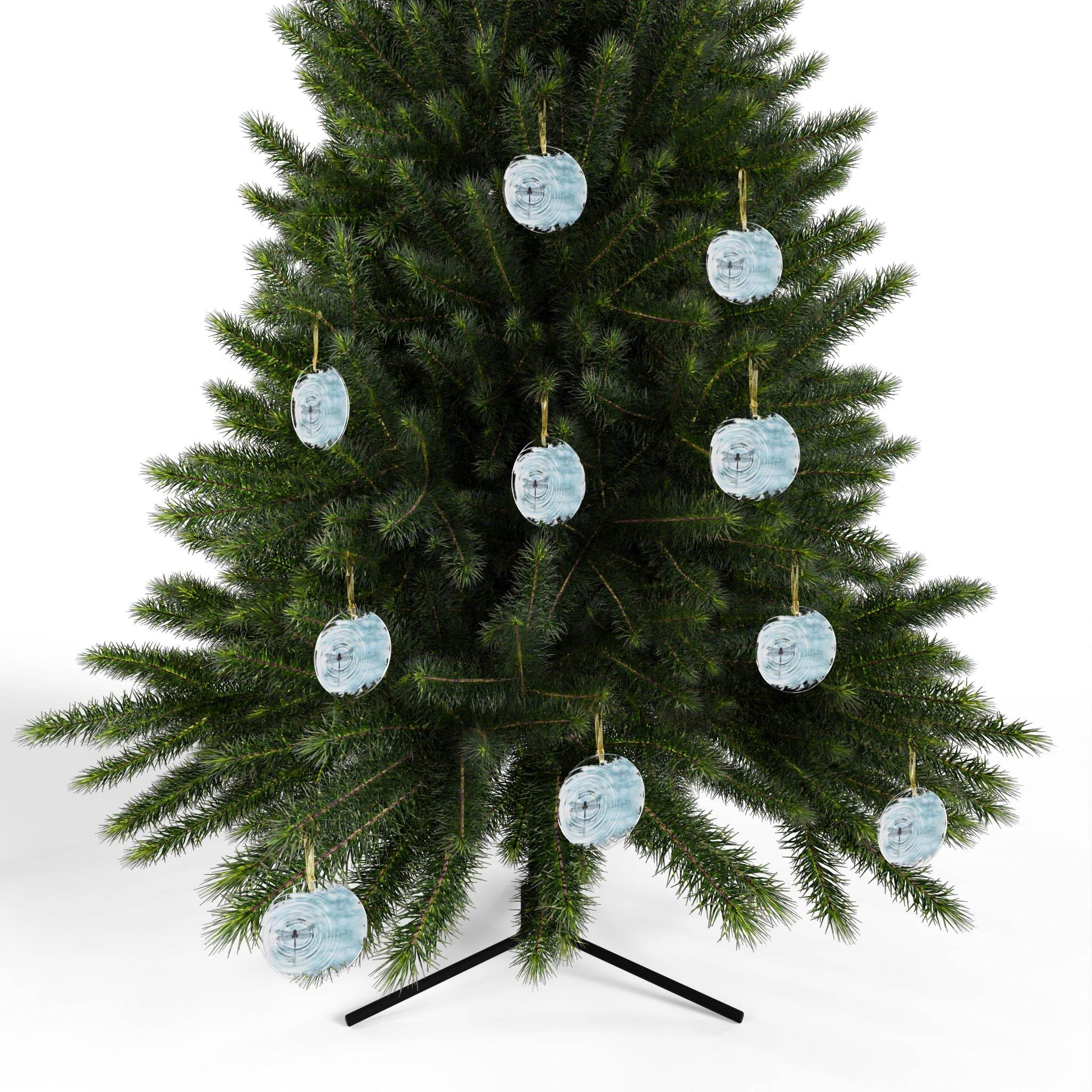 Christmas tree decorated with multiple light blue dragonfly christmas ornament by Printify