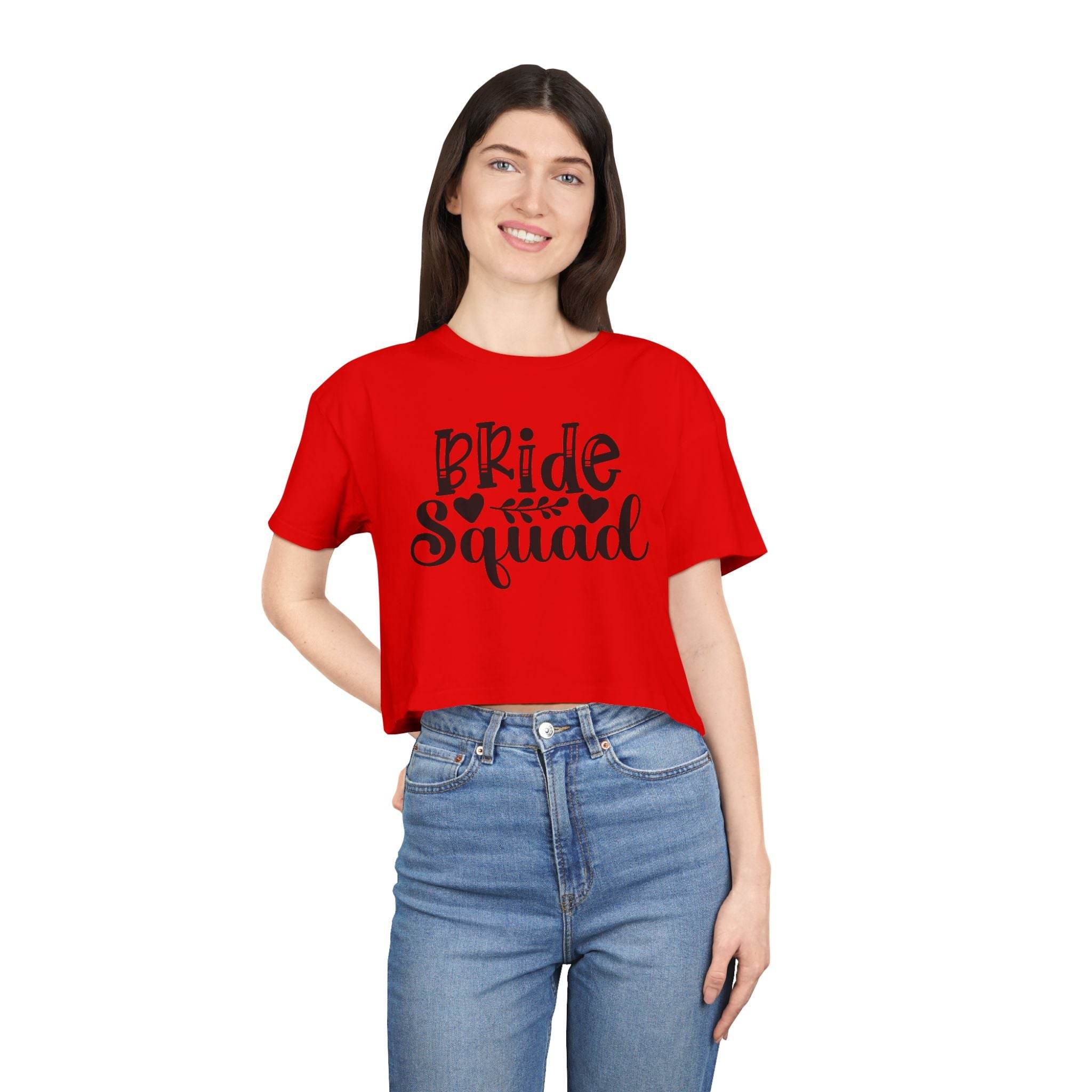Printify eco-friendly bride squad crop top red crop tee with black Bride Squad graphic worn by smiling model