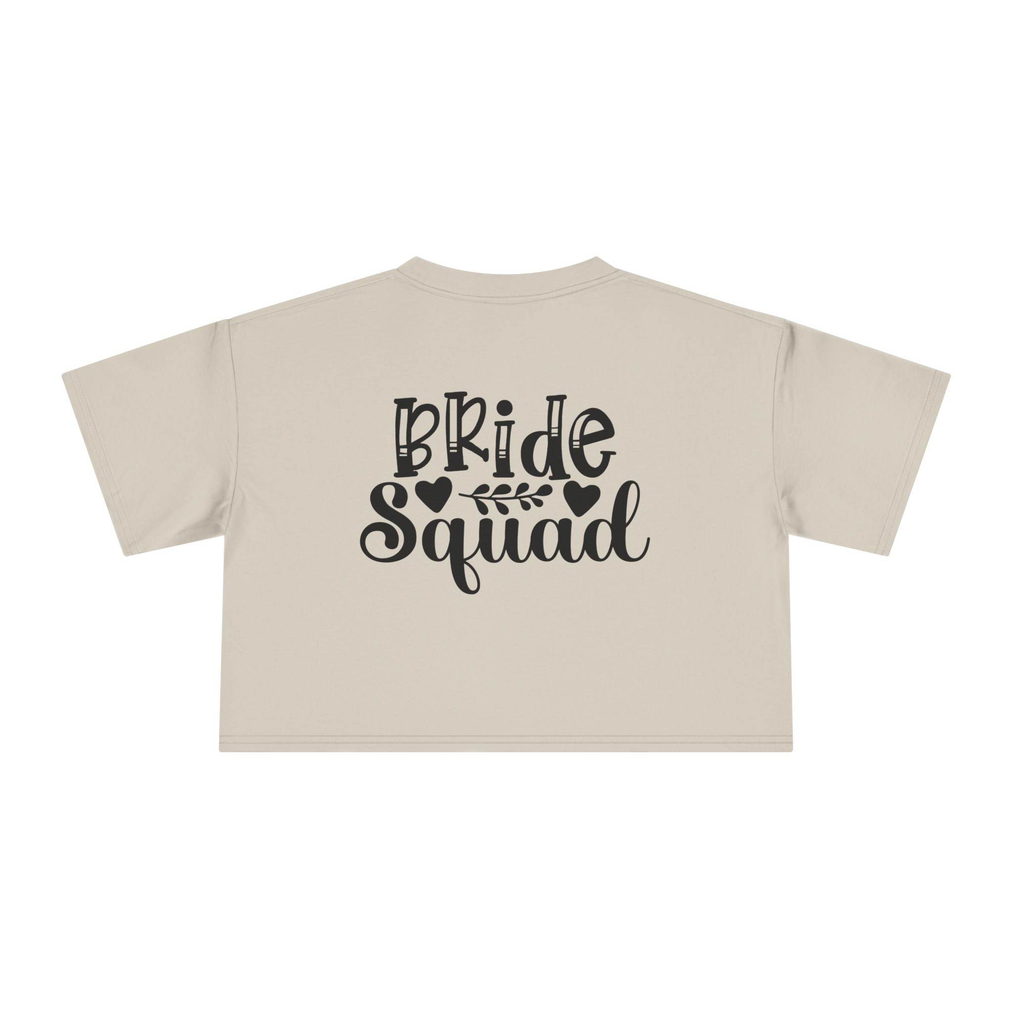 Printify beige cropped t shirt back view with black Bride Squad script and hearts eco-friendly bride squad crop top