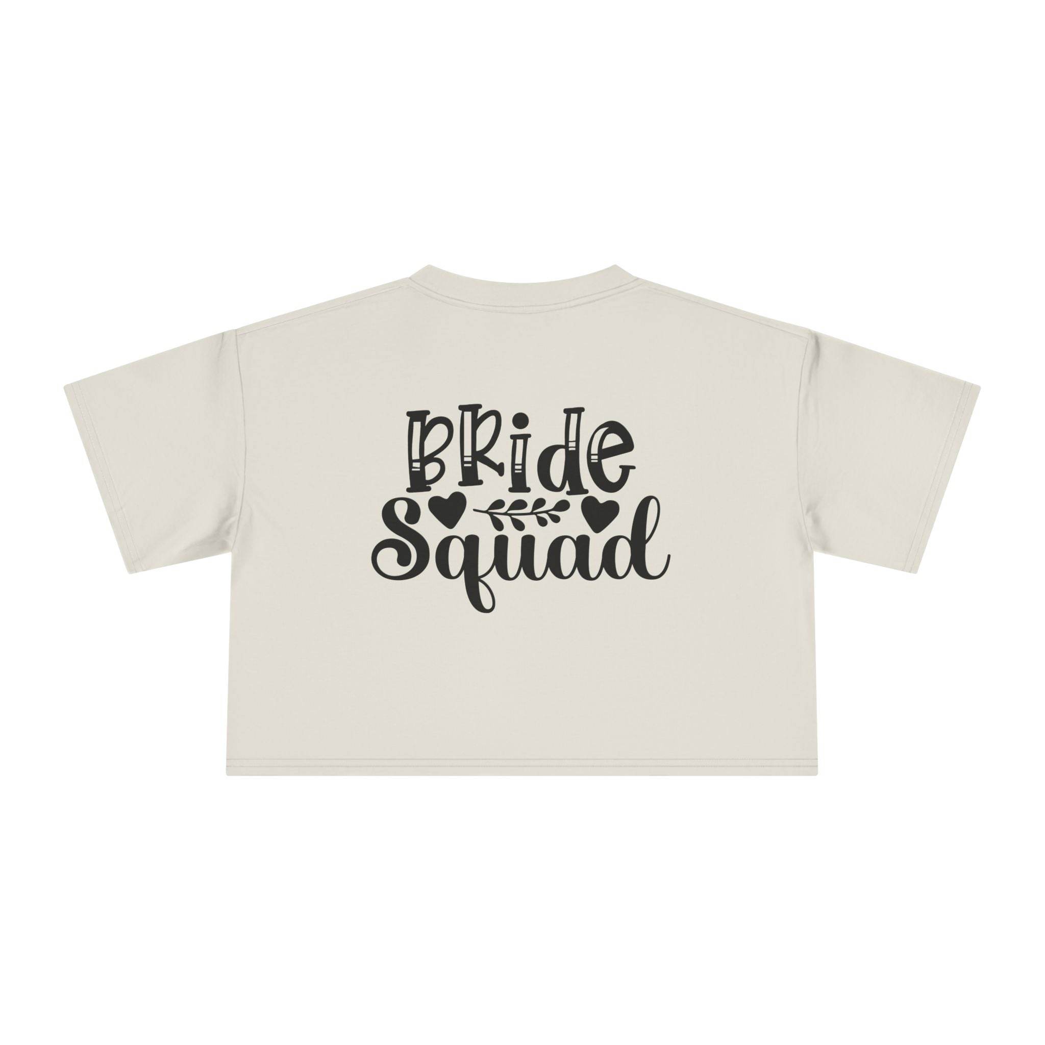 Printify eco-friendly bride squad crop top cream cropped T shirt back view with black Bride Squad script heart and leaf design