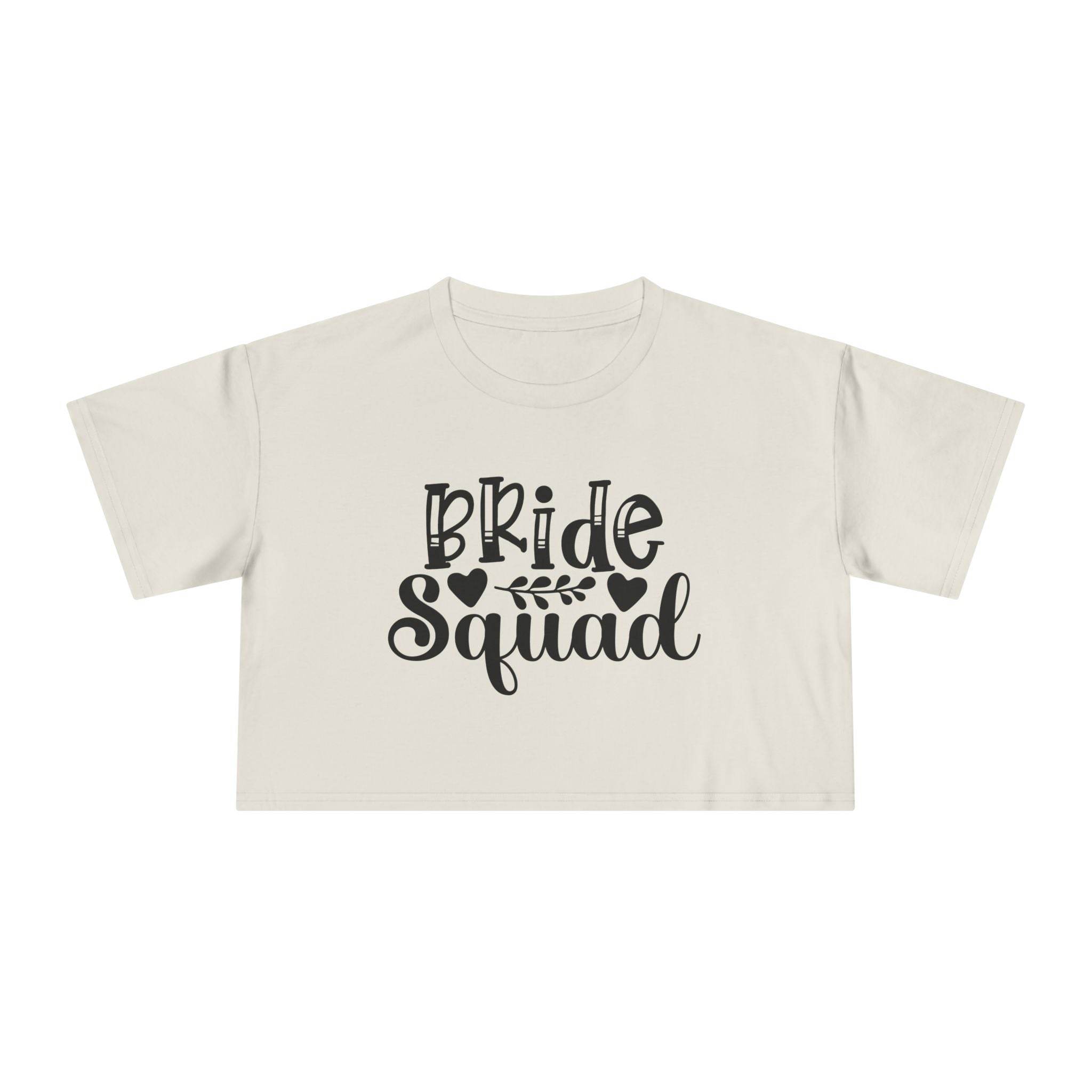 Printify eco-friendly bride squad crop top cream short sleeve cropped tee with black Bride Squad script and leaf design
