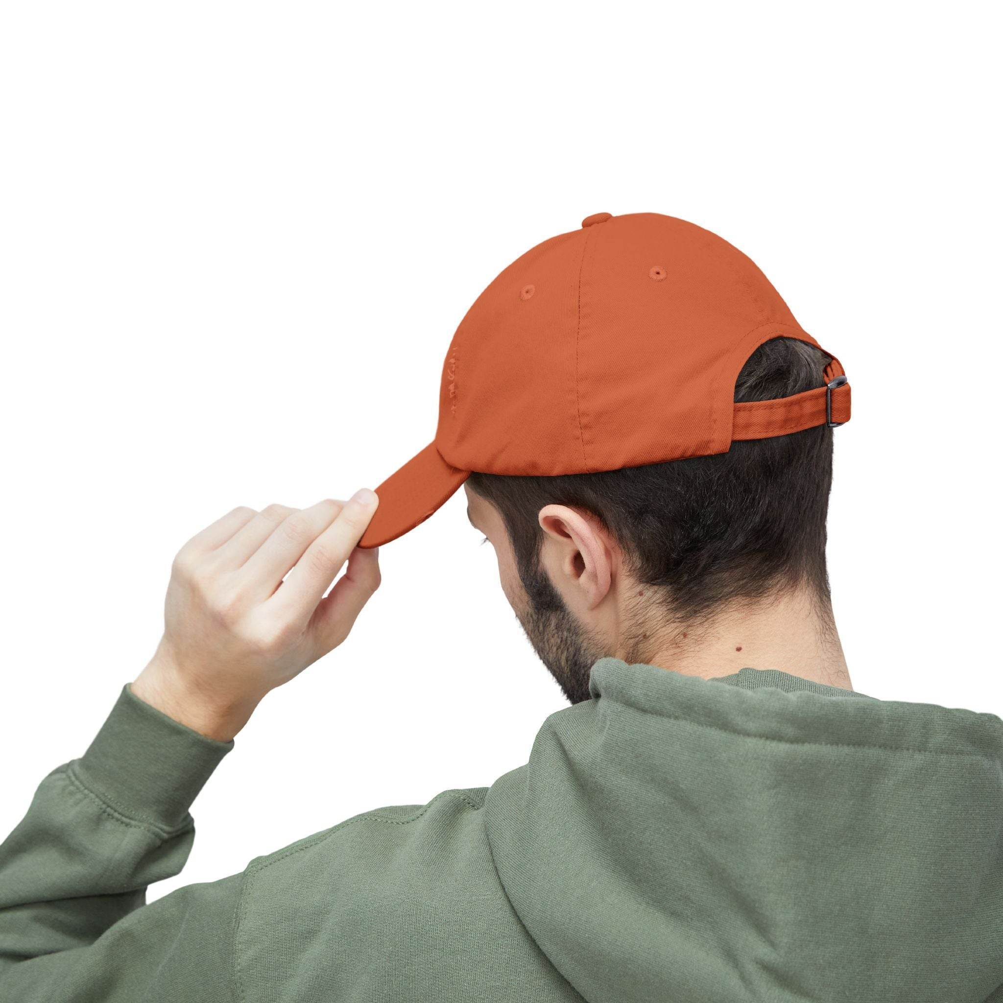 Back view of man adjusting orange Printify eco-friendly pet lover hat with adjustable strap