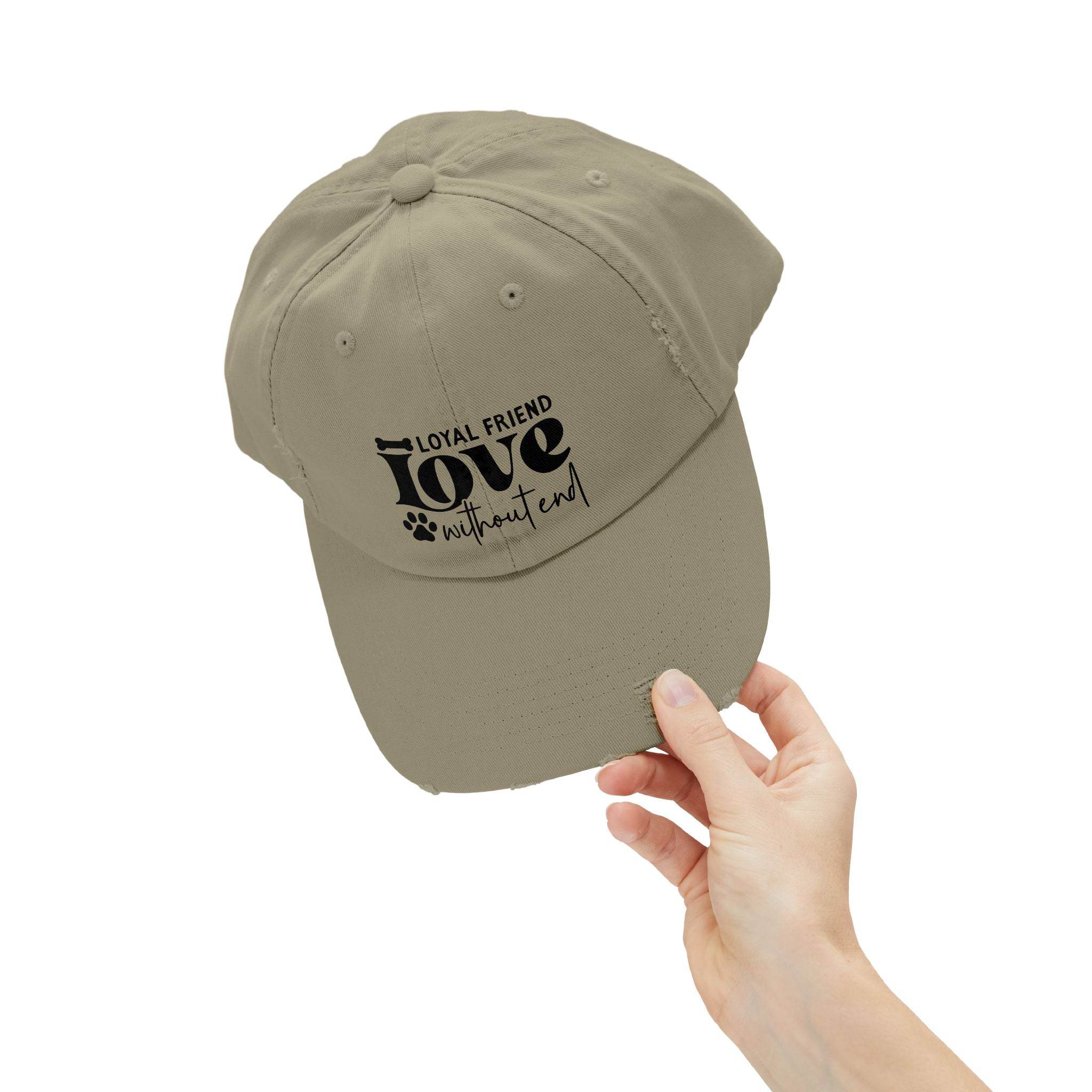 Printify khaki eco-friendly pet lover hat with black paw print Loyal Friend love without end design held in hand