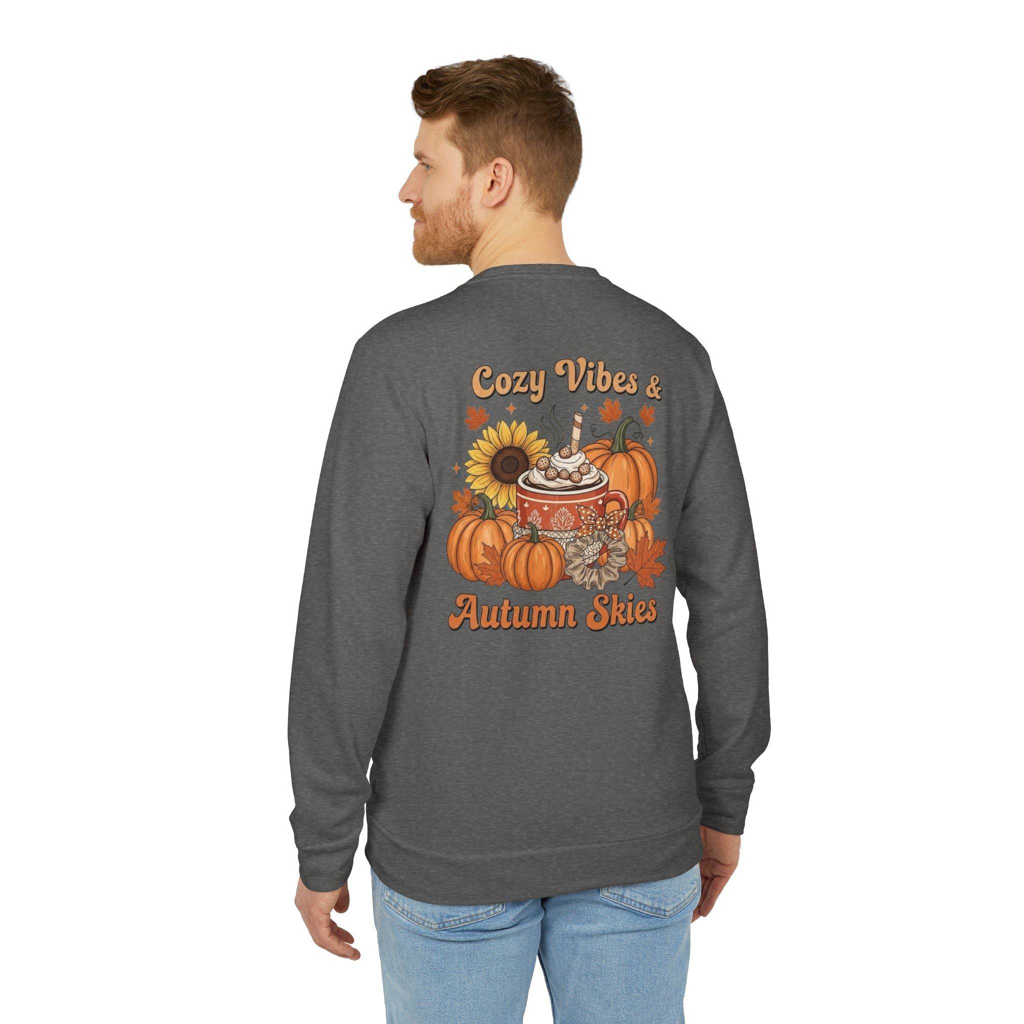 Man wearing gray Printify sweatshirt with fall pumpkin mug sunflower print on back eco-friendly autumn sweatshirt