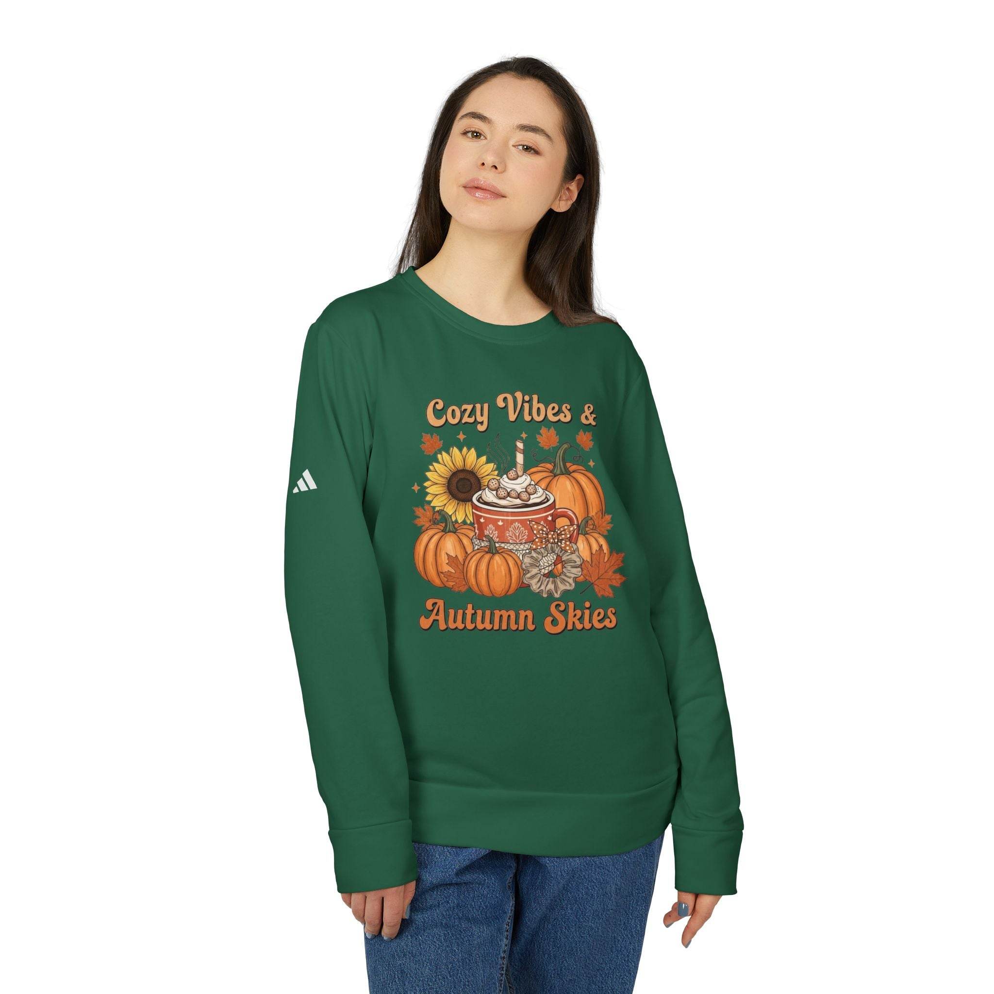 Green crewneck featuring Cozy Vibes and Autumn Skies pumpkin sunflower mug graphic worn by model eco-friendly autumn sweatshirt