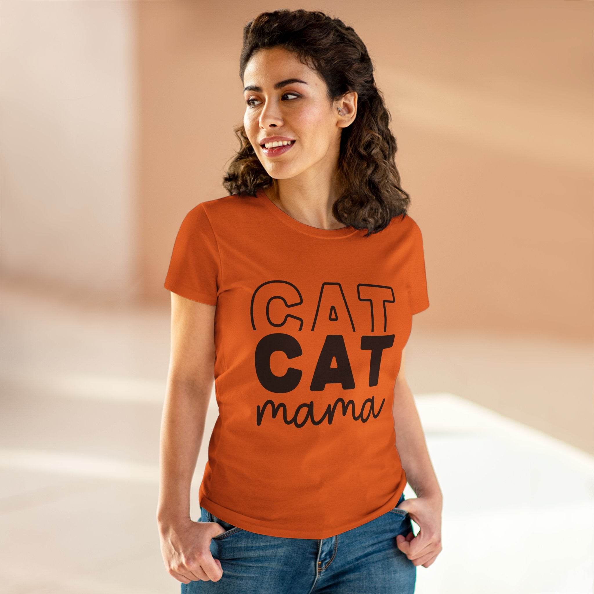 Woman wearing orange eco-friendly cat mom shirt from Printify featuring bold CAT CAT mama graphic and casual fit