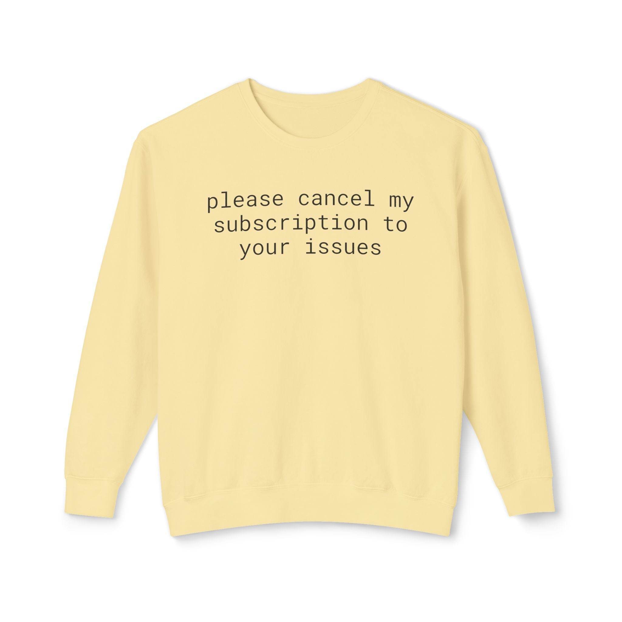 Printify pale yellow sweatshirt with black text please cancel my subscription to your issues eco-friendly funny sweatshirt