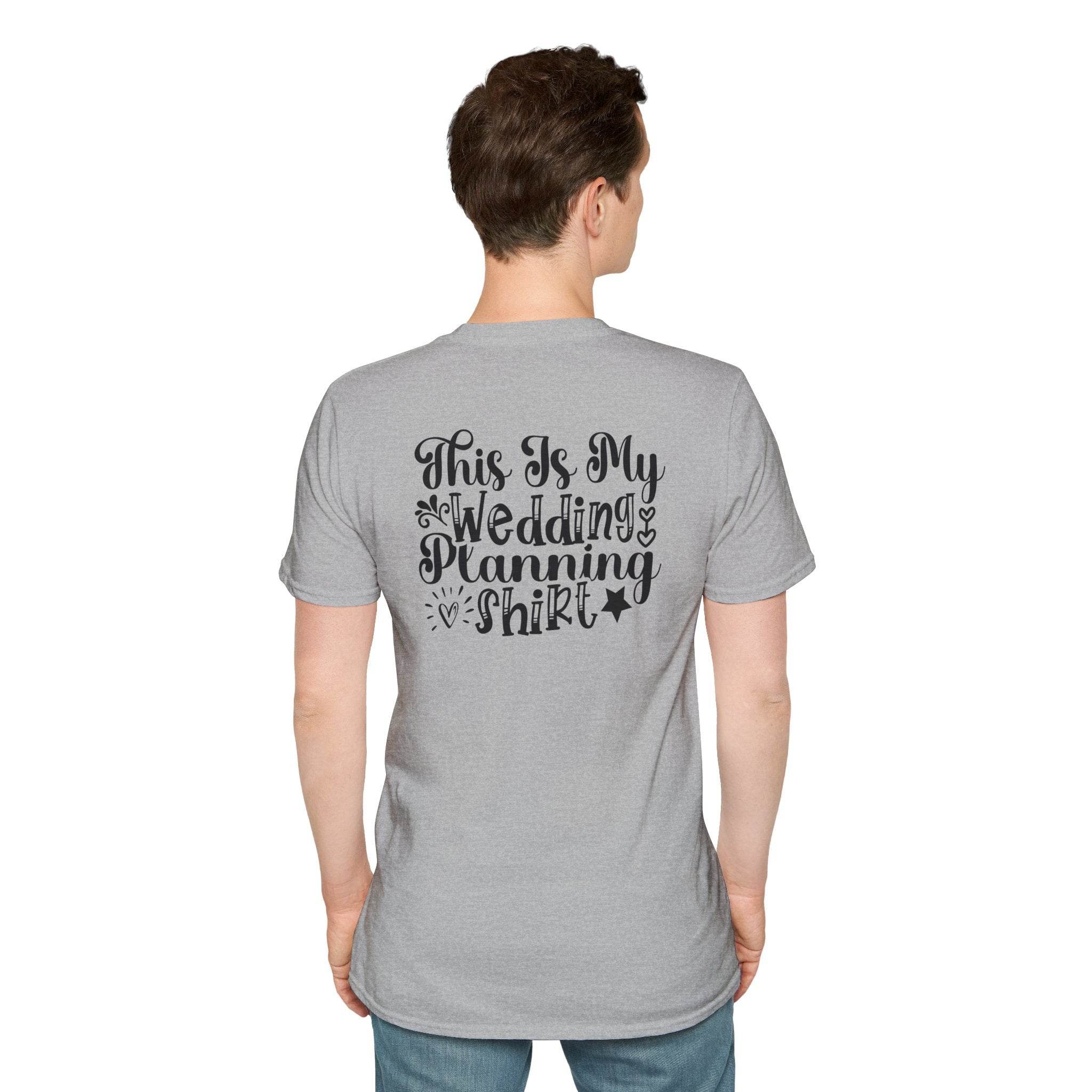 Man wearing heather gray T shirt with black script This Is My Wedding Planning Shirt on back eco-friendly wedding planning shirt