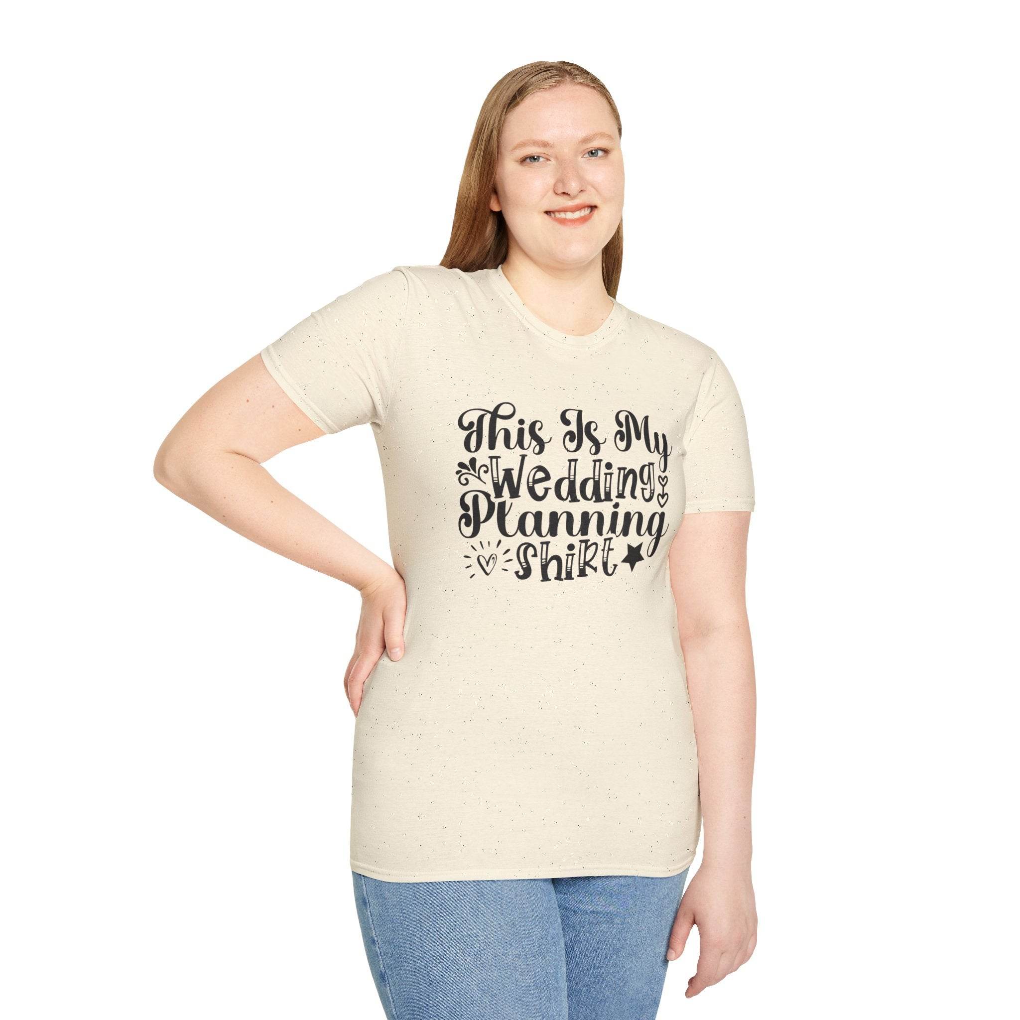 Smiling woman wearing eco-friendly wedding planning shirt cream t shirt with black script text This Is My Wedding Planning Shirt
