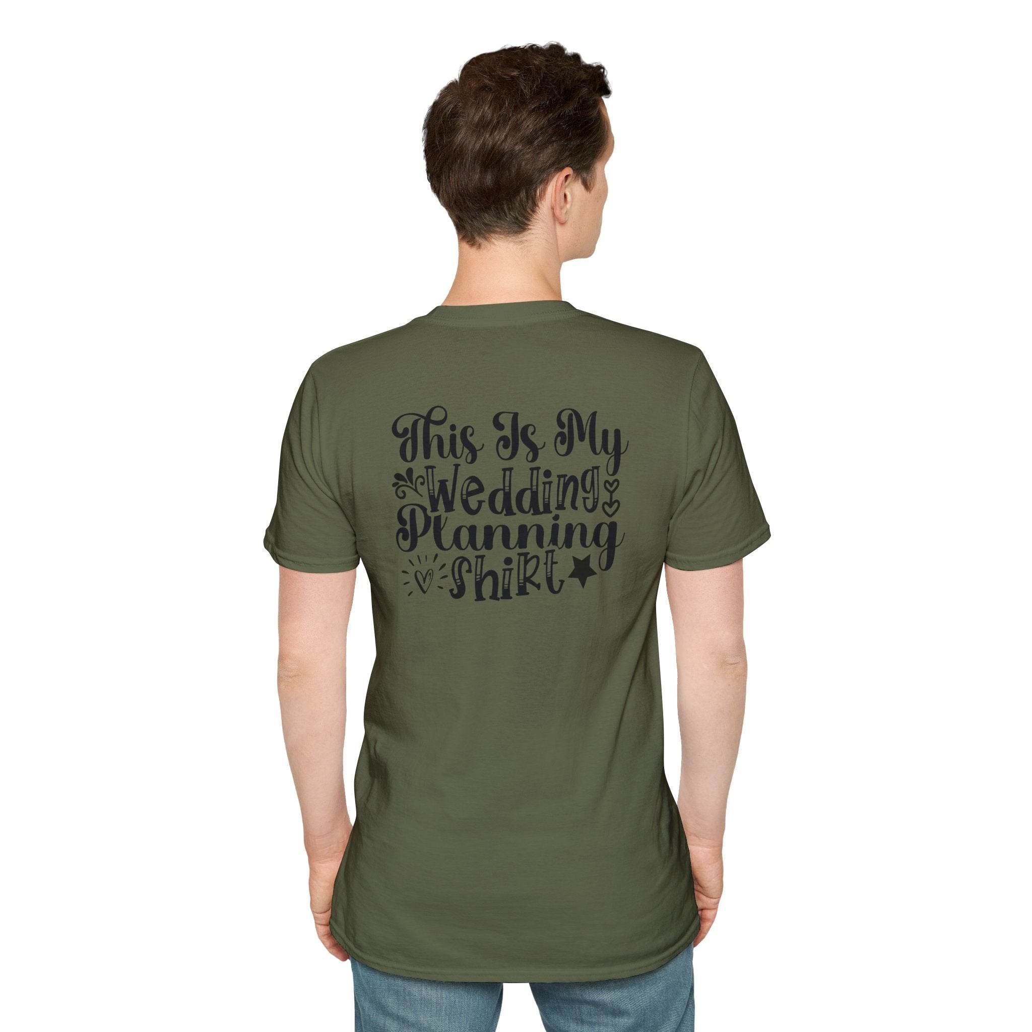 Back view of man wearing olive green eco-friendly wedding planning shirt with black script text