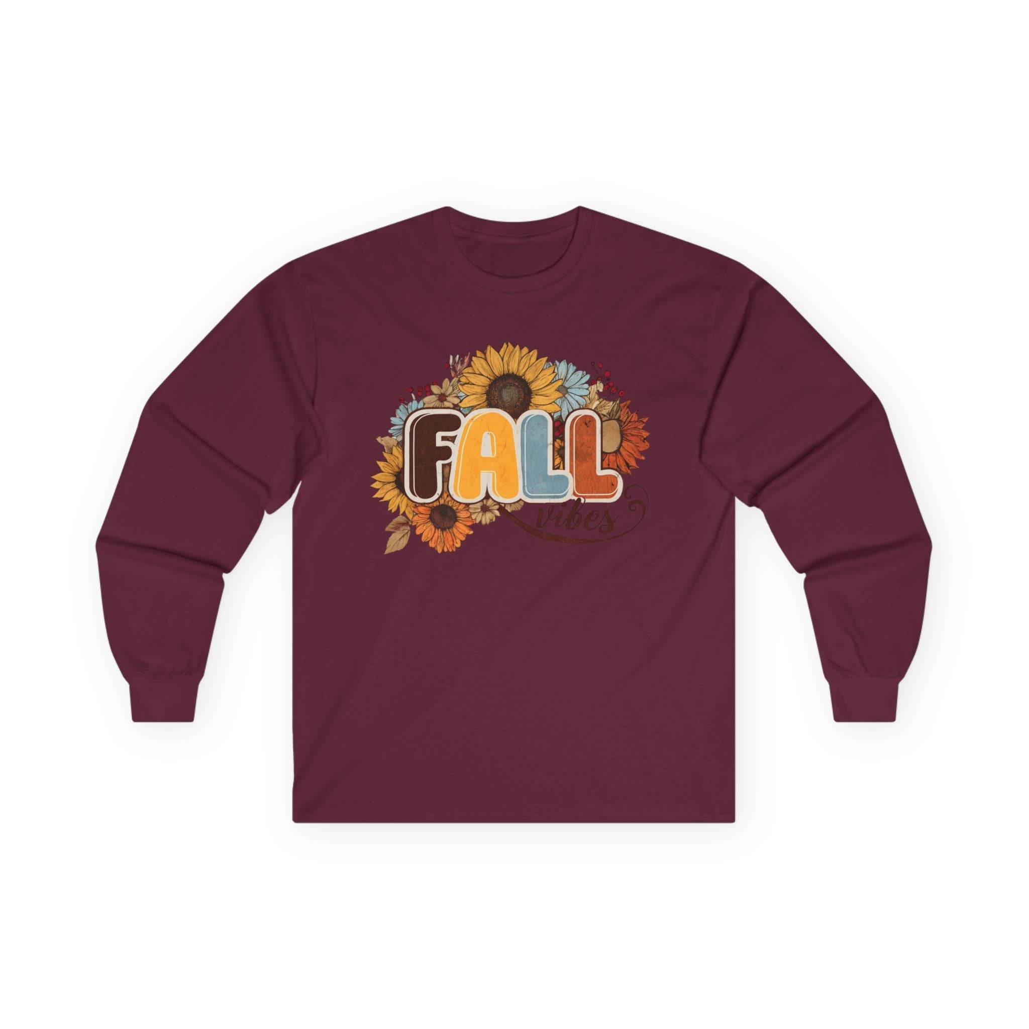 Maroon long sleeve Printify tee with sunflower fall graphic reading FALL in retro colors eco-friendly fall fashion tee
