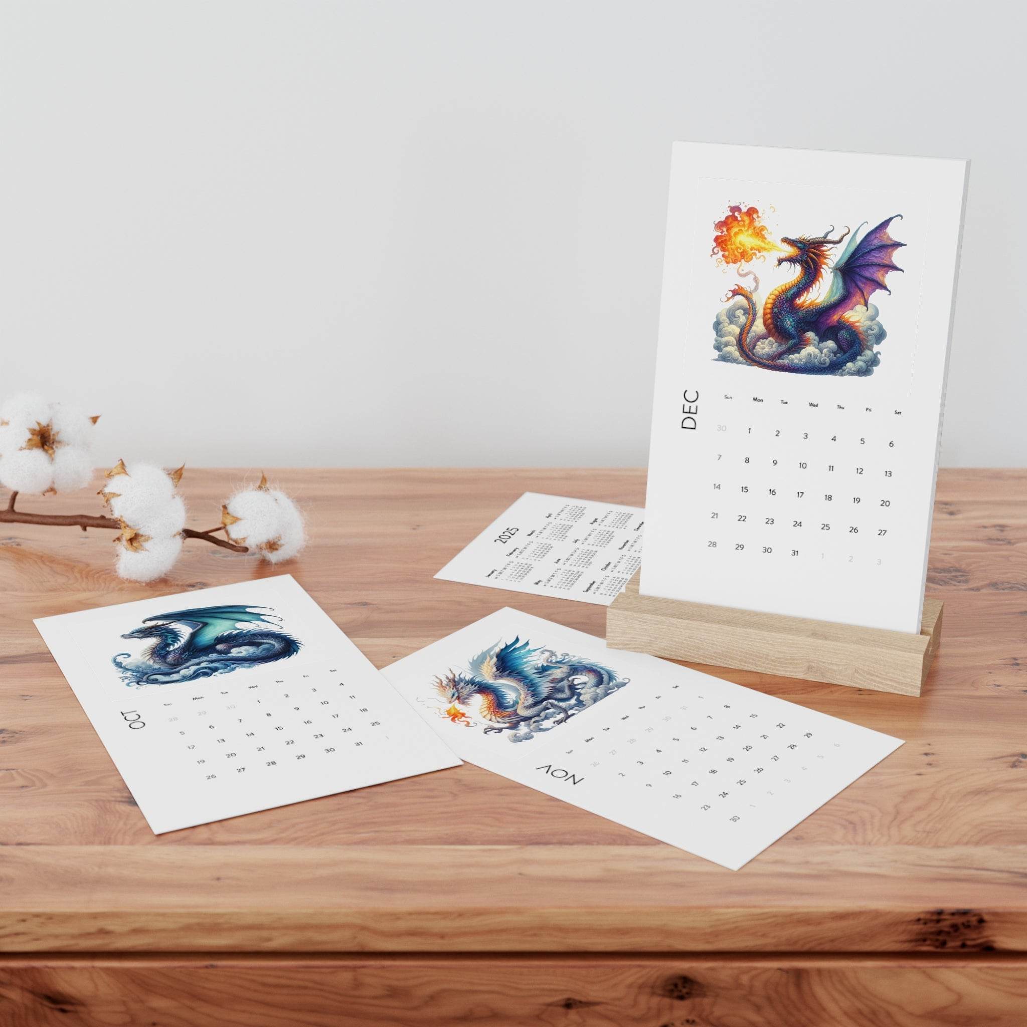 Printify eco-friendly 2025 desk calendar with dragon illustrations on wooden stand and loose monthly pages