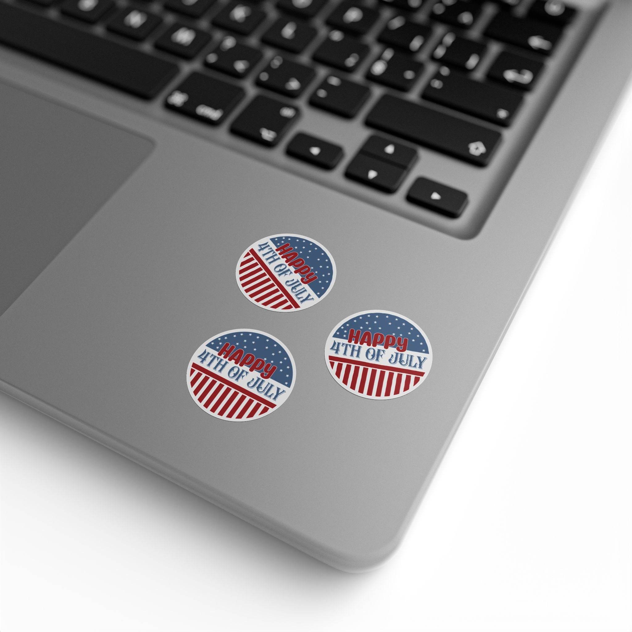 Eco-friendly 4th of July stickers with patriotic red white and blue design on laptop surface