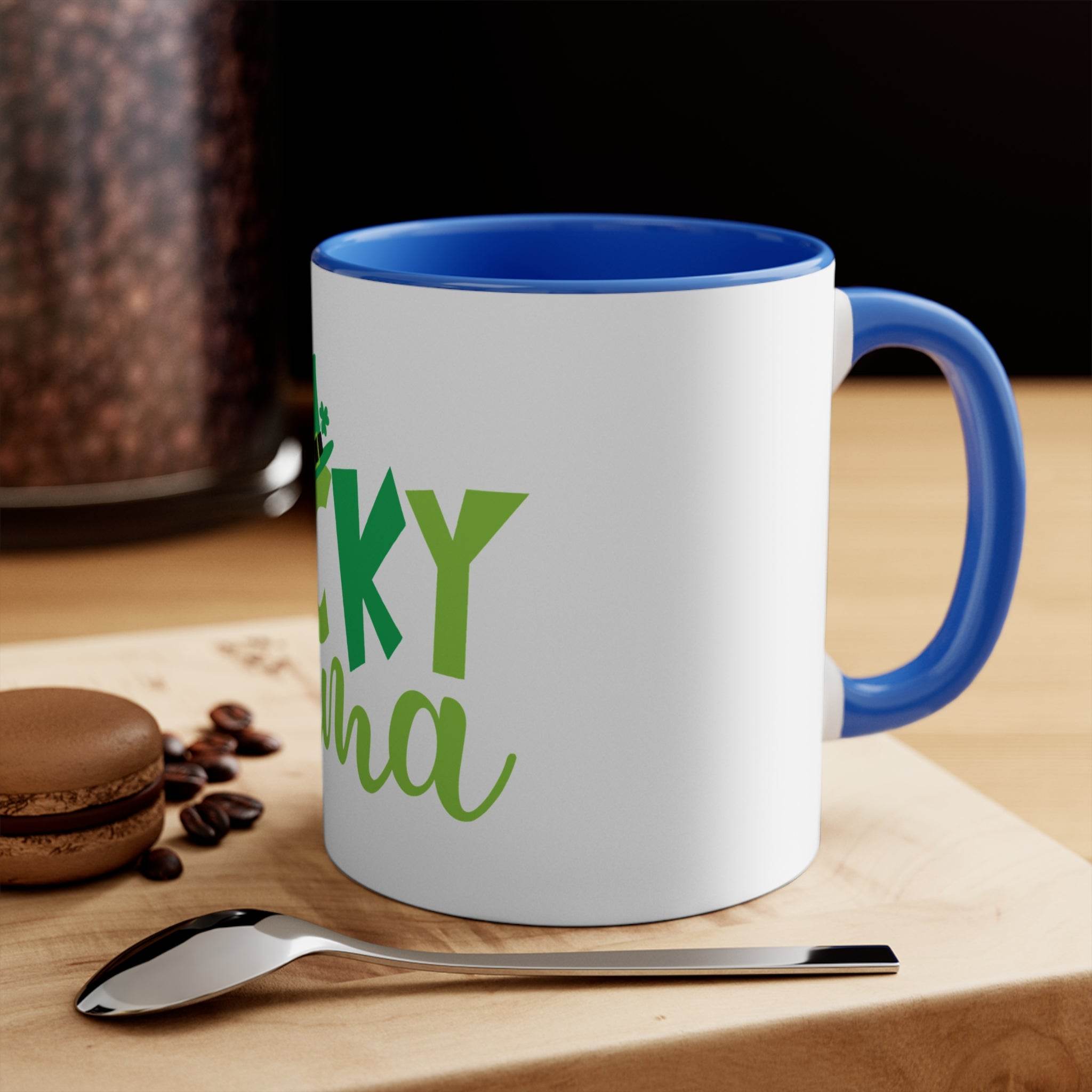 Printify eco-friendly accent mug with blue handle and rim on wooden table with spoon and macaron