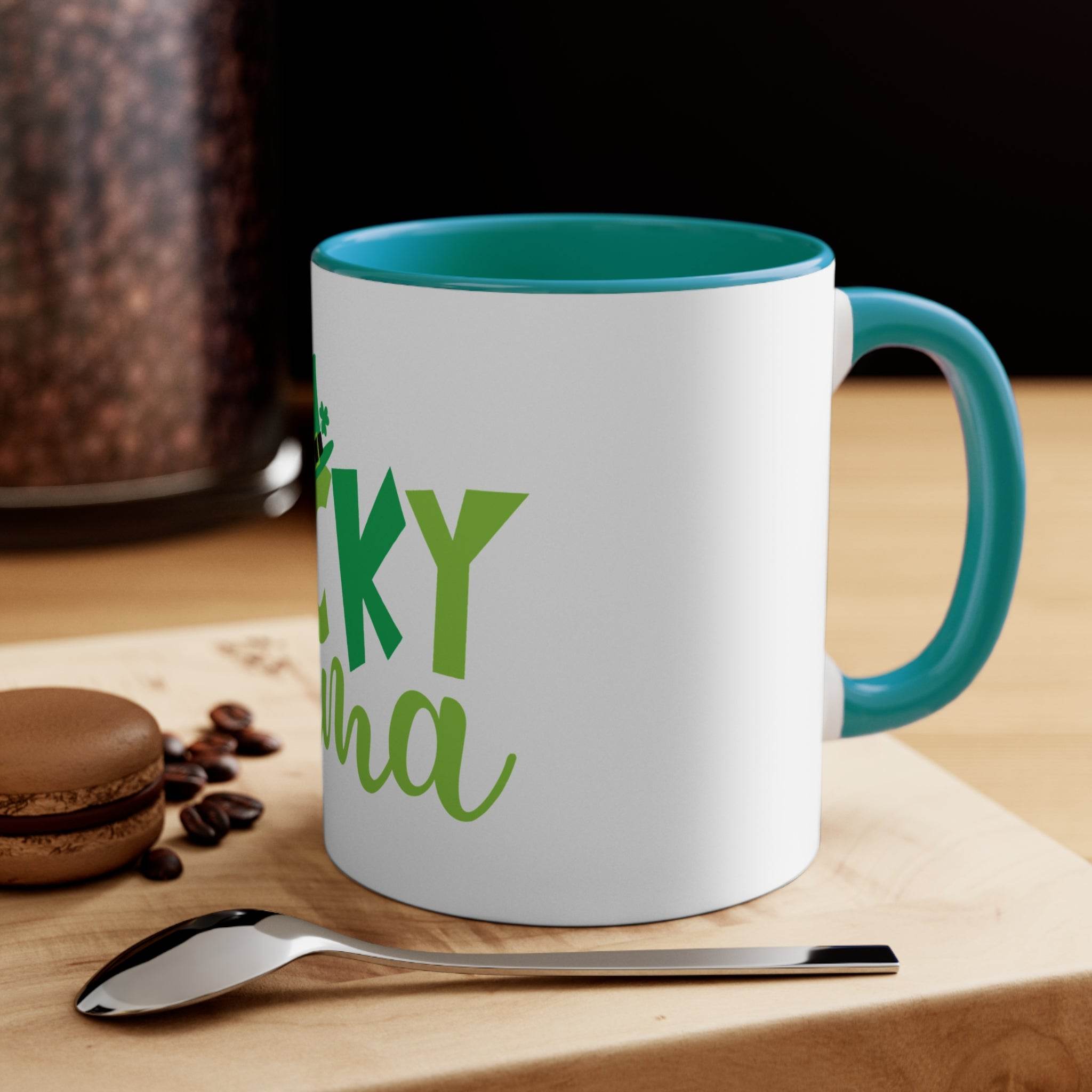 Printify eco-friendly accent mug with teal handle and interior on a wooden table with coffee beans and a macaron