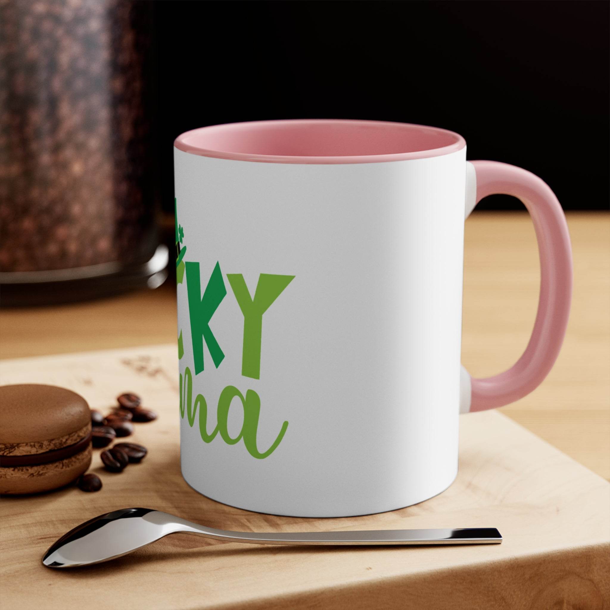 Printify eco-friendly accent mug with pink handle and rim featuring green lettering on white ceramic