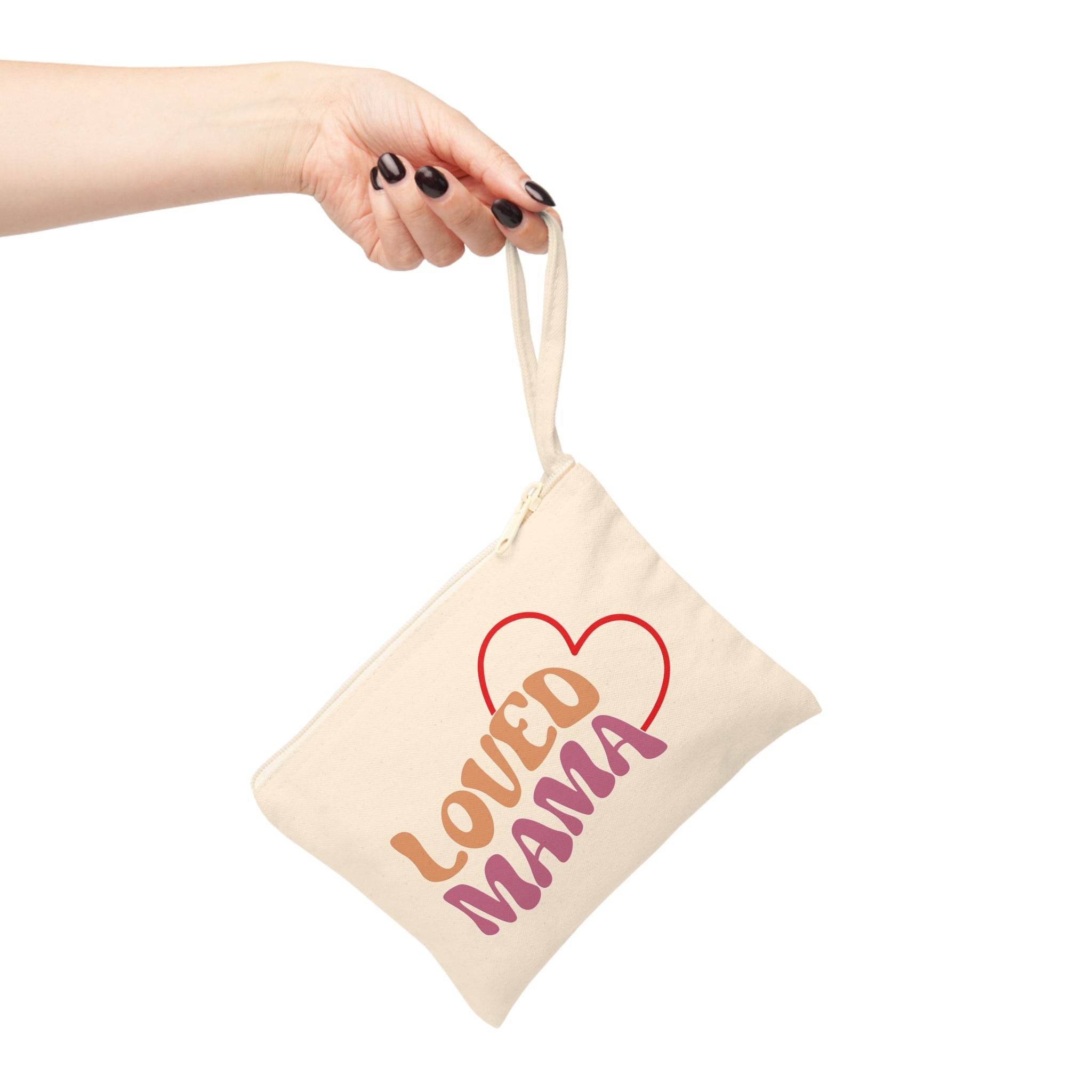 Printify eco-friendly accessory pouch in beige with Loved Mama design held by hand