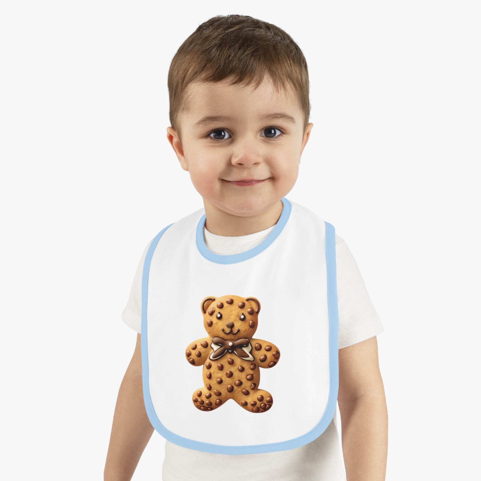 Toddler wearing a Printify eco-friendly baby bib with a teddy bear cookie design and light blue trim
