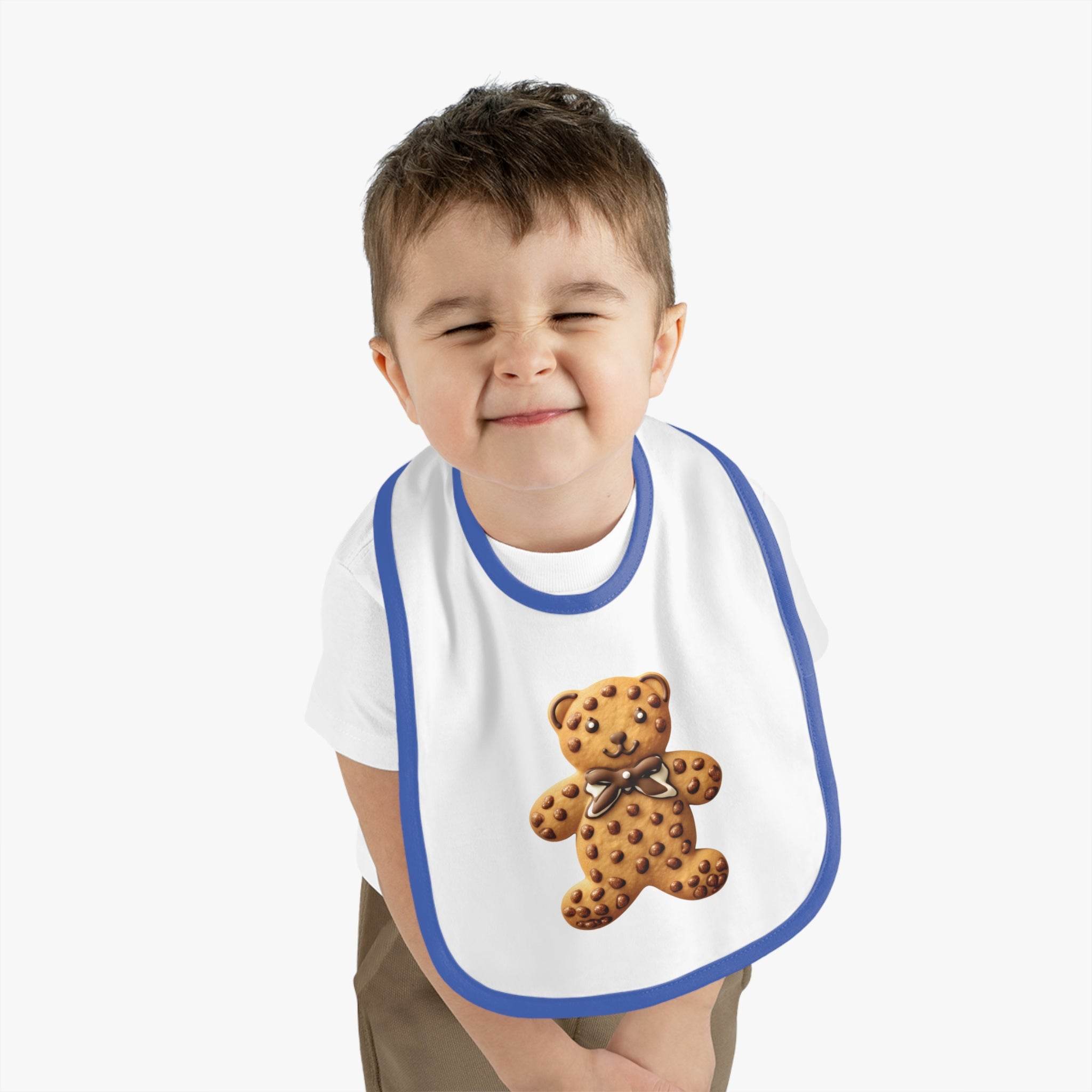 Toddler wearing Printify eco-friendly baby bib with blue trim and teddy bear design