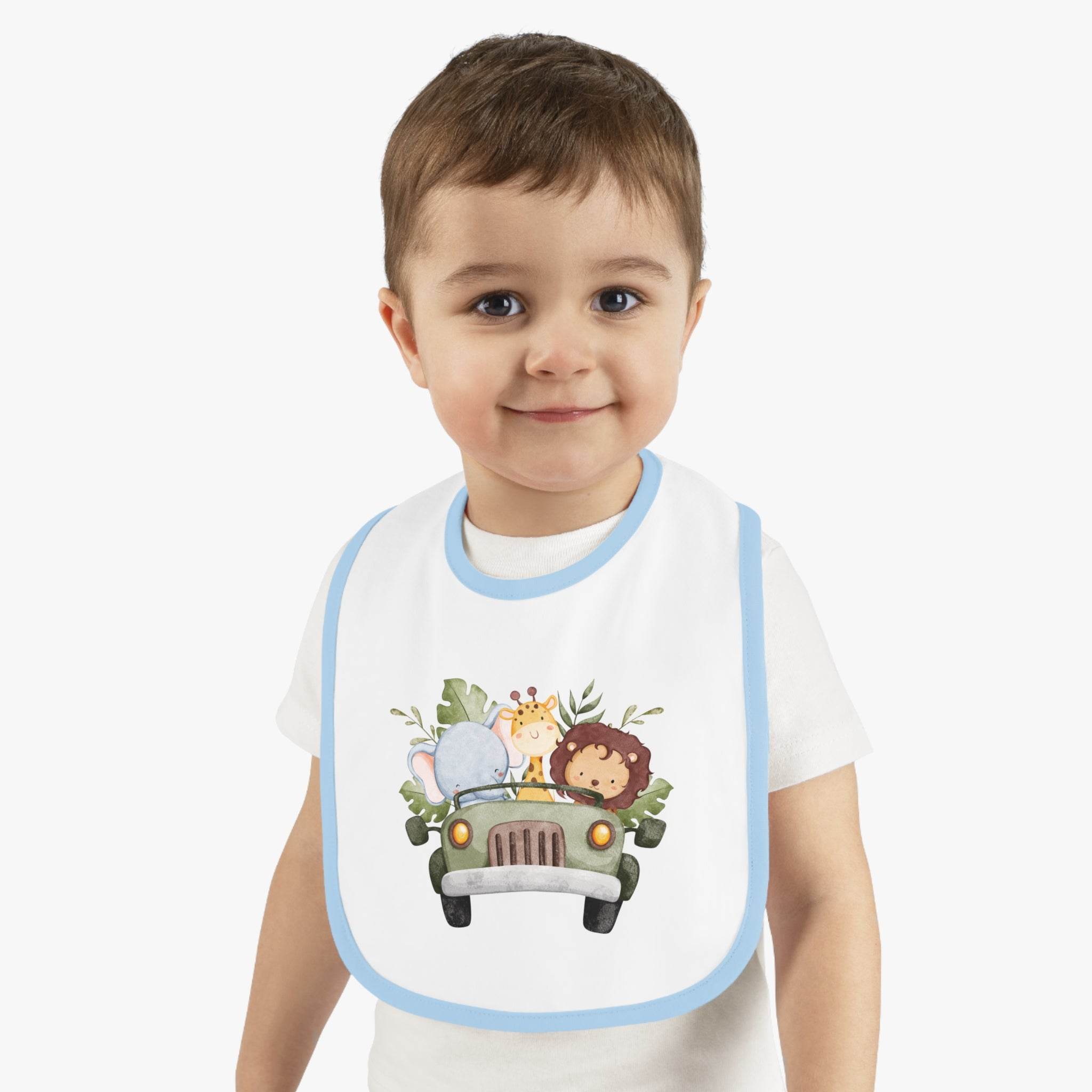 Toddler wearing eco-friendly baby bib with blue trim and cute safari animal print by Printify