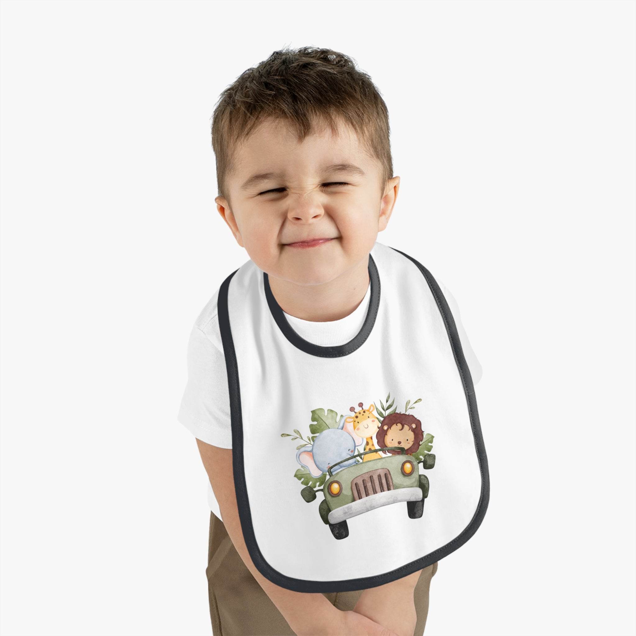 Toddler wearing Printify eco-friendly baby bib with jungle animals in a car design