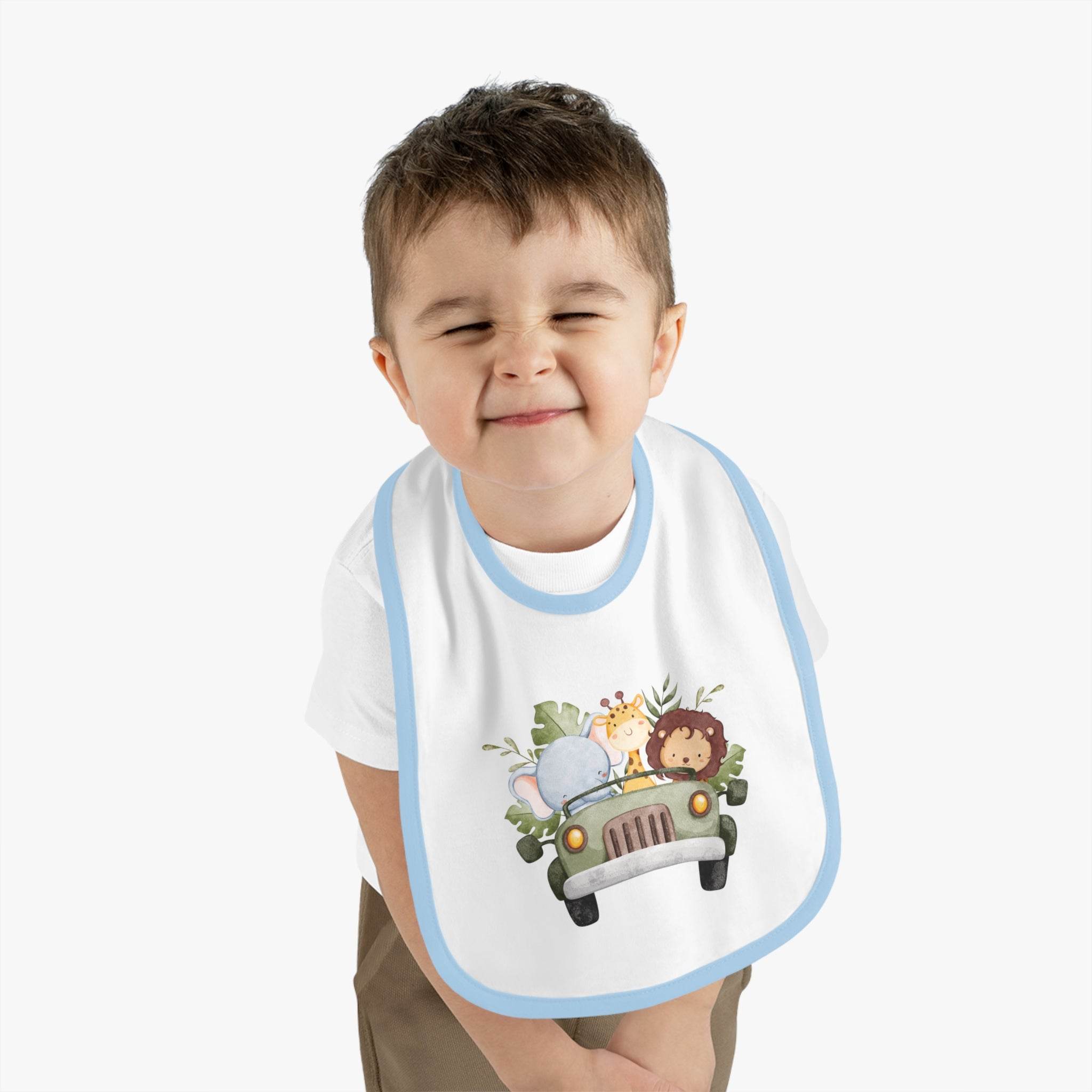 Printify eco-friendly baby bib with blue trim and cute safari animal design worn by smiling toddler