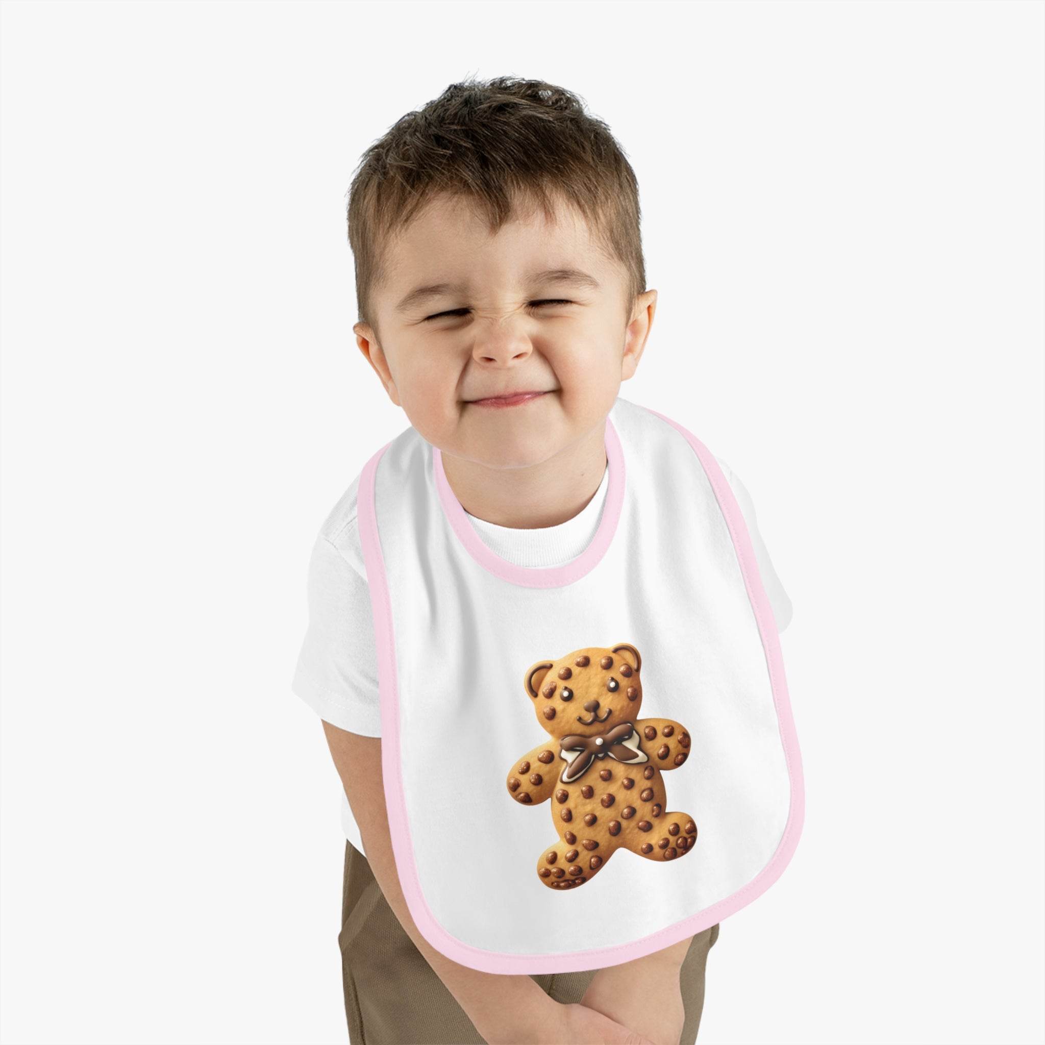 Toddler wearing Printify eco-friendly baby bib with pink trim and teddy bear design