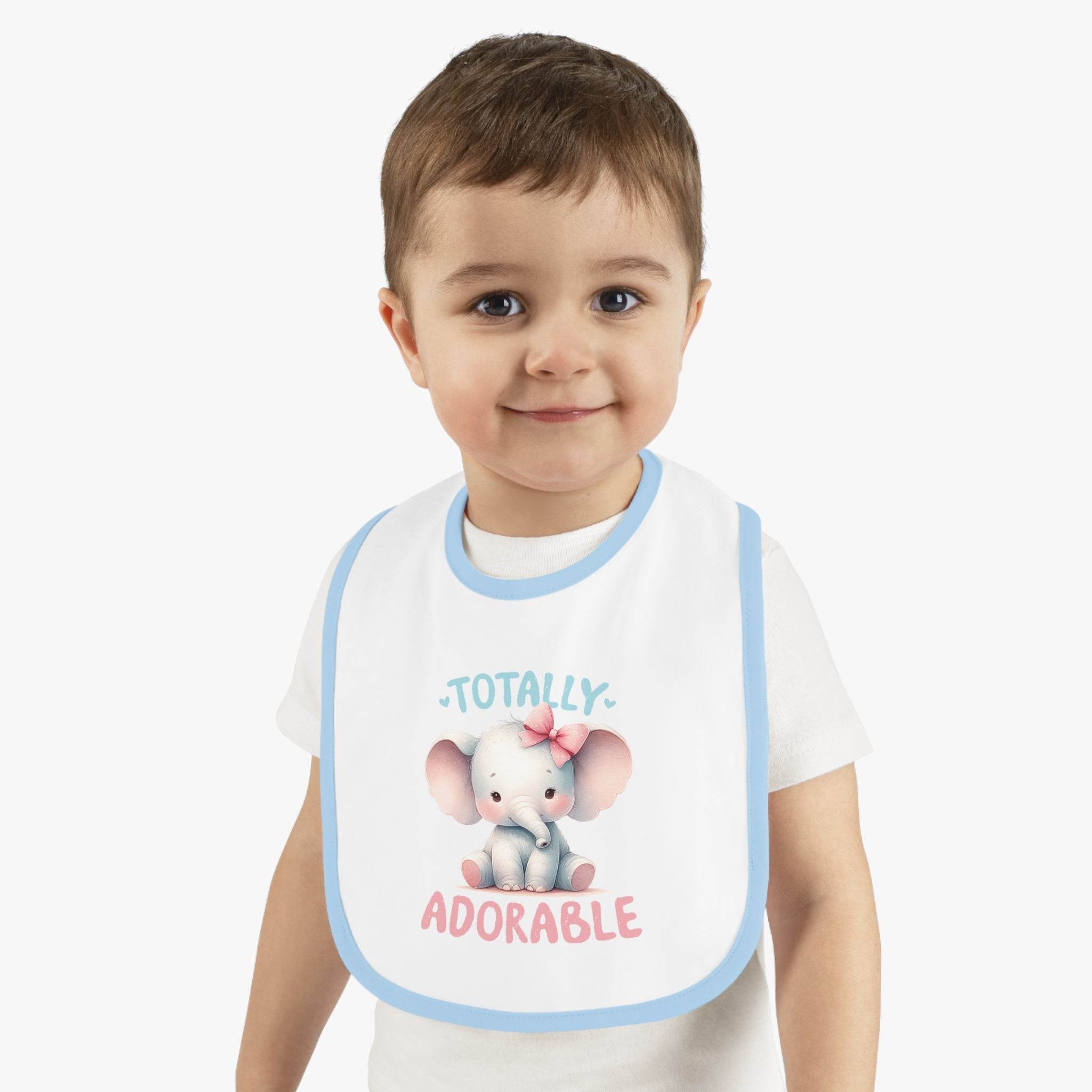 Toddler wearing a Printify eco-friendly baby bib with blue trim and adorable elephant design