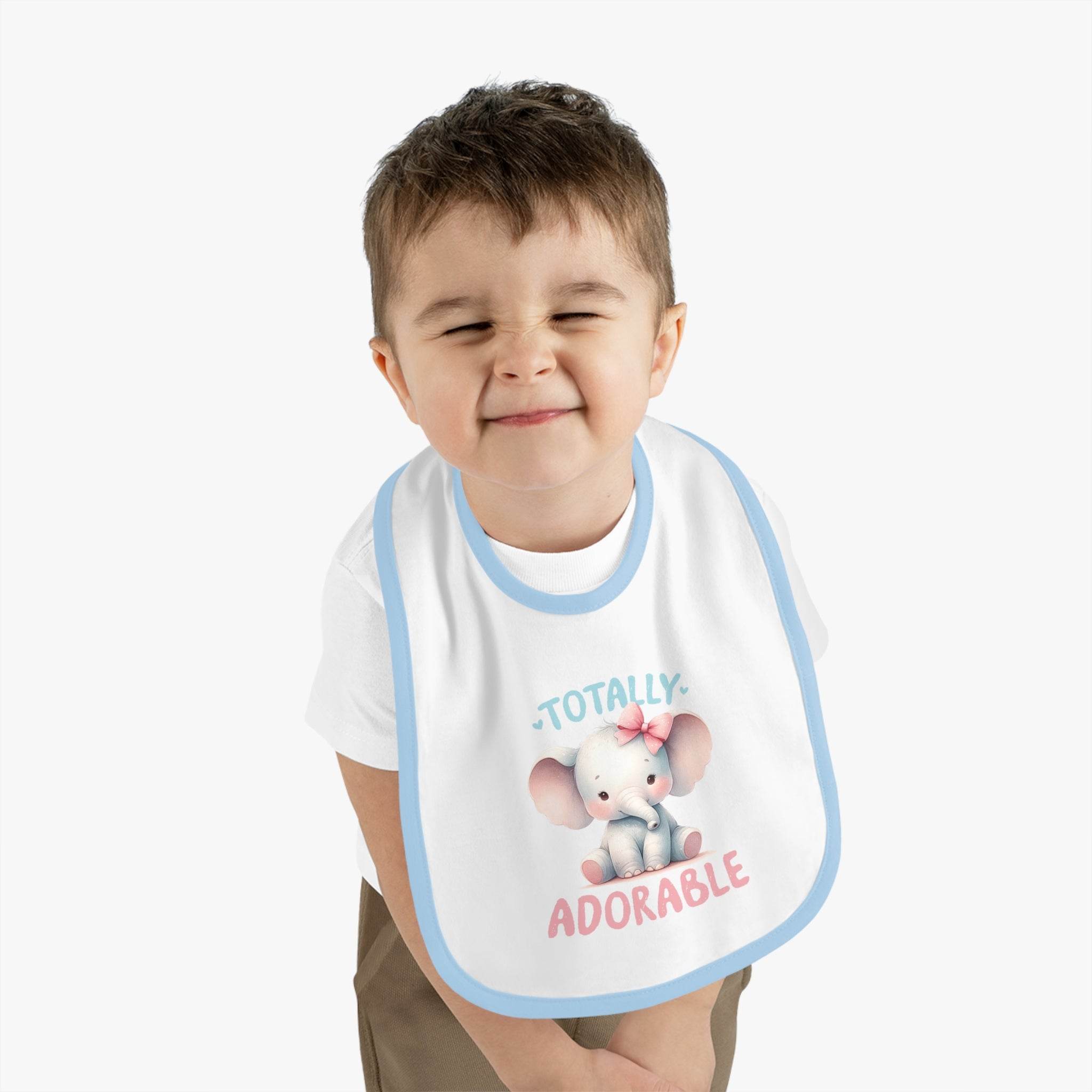 Printify eco-friendly baby bib with cute elephant design and blue trim worn by smiling toddler