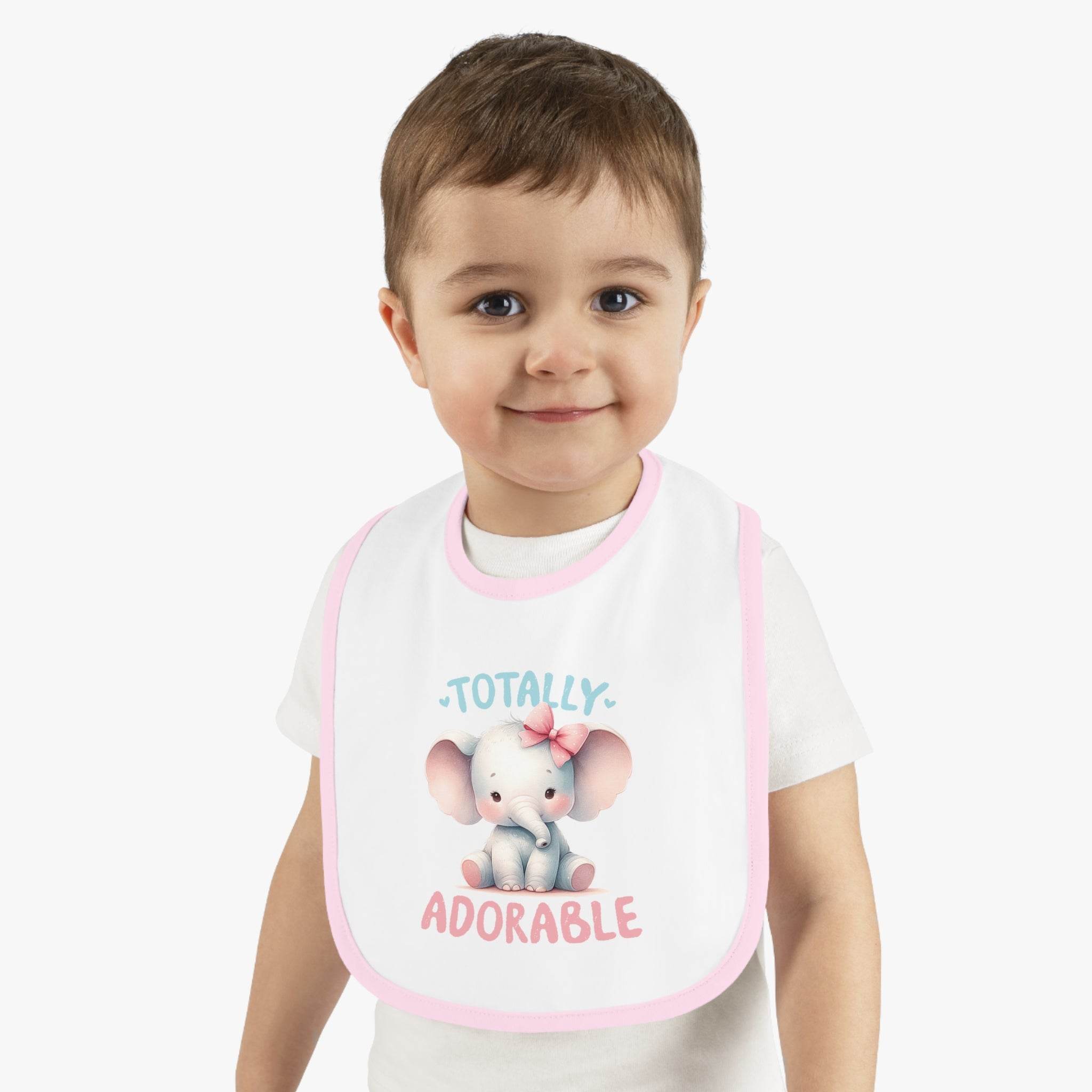 Toddler wearing Printify eco-friendly baby bib with pink trim and cute elephant design