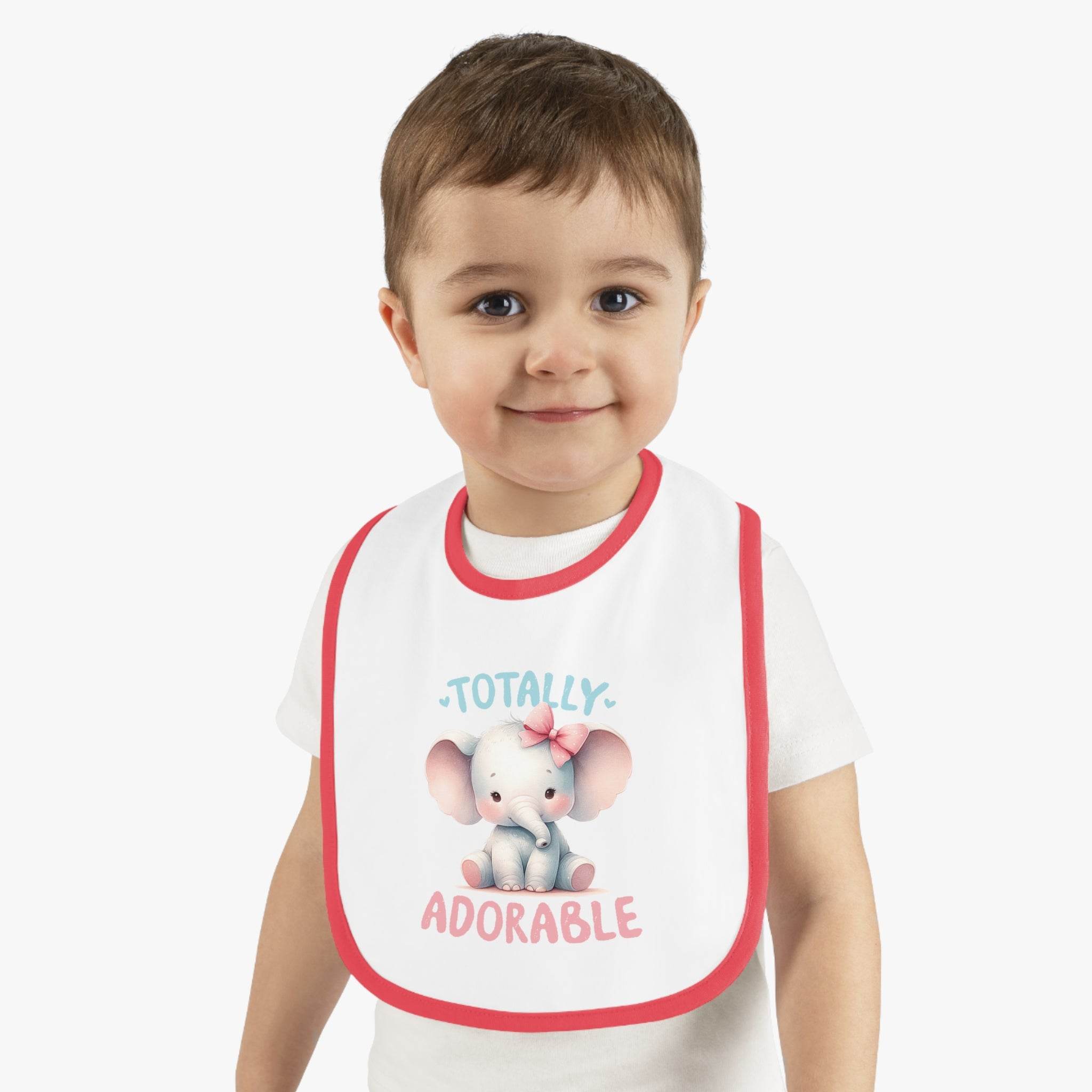 Toddler wearing Printify eco-friendly baby bib with pink elephant and totally adorable text