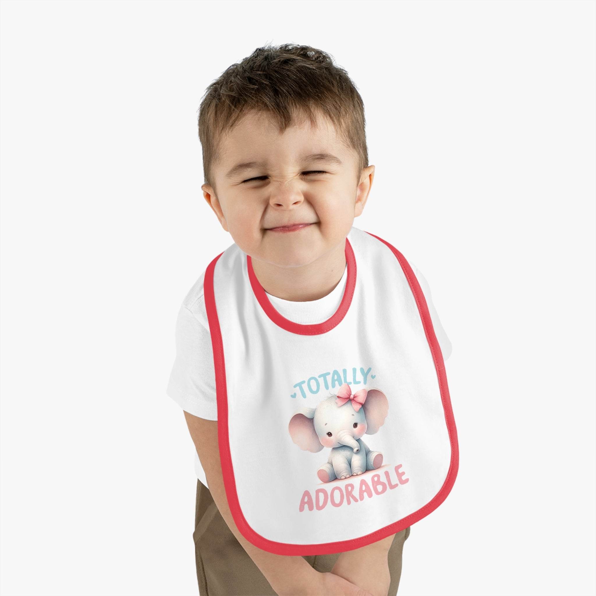 Toddler wearing Printify eco-friendly baby bib with cute elephant and totally adorable text