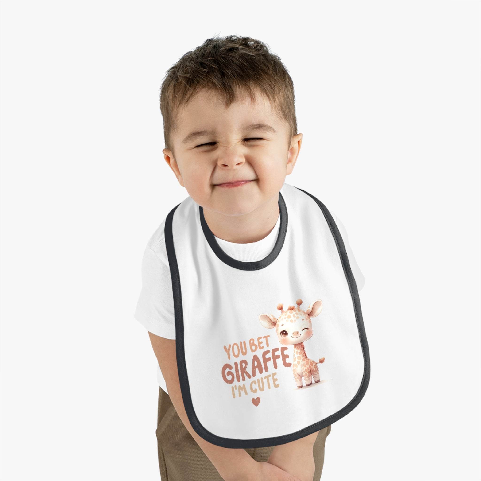 Toddler wearing Printify eco-friendly baby bib with cute giraffe design and text You Bet Giraffe I'm Cute