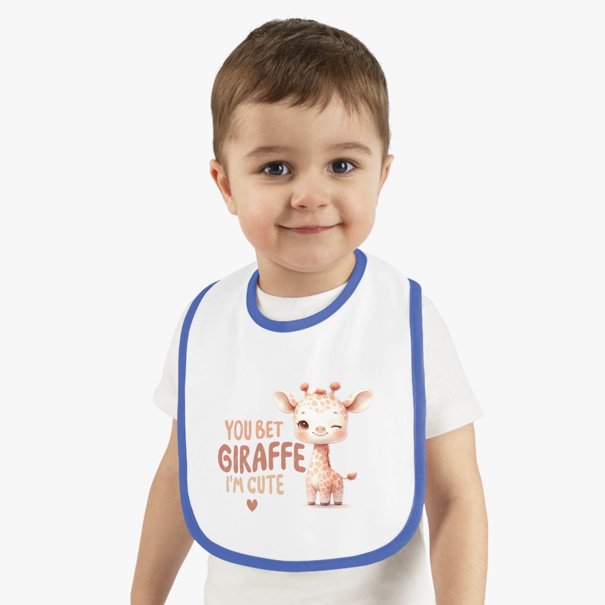 Toddler wearing Printify eco-friendly baby bib with blue trim and cute giraffe design
